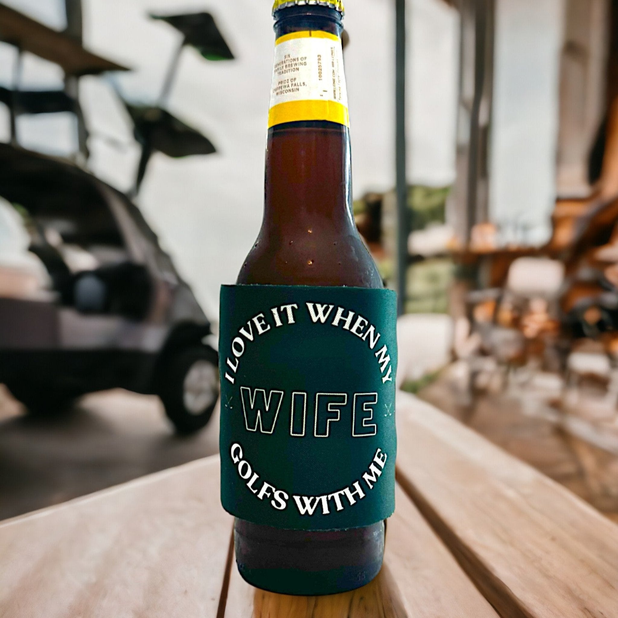 Beer bottle featuring a fun, golf-themed koozie with the message 'I love it when my wife golfs with me', perfect for golf enthusiasts looking for quirky accessories