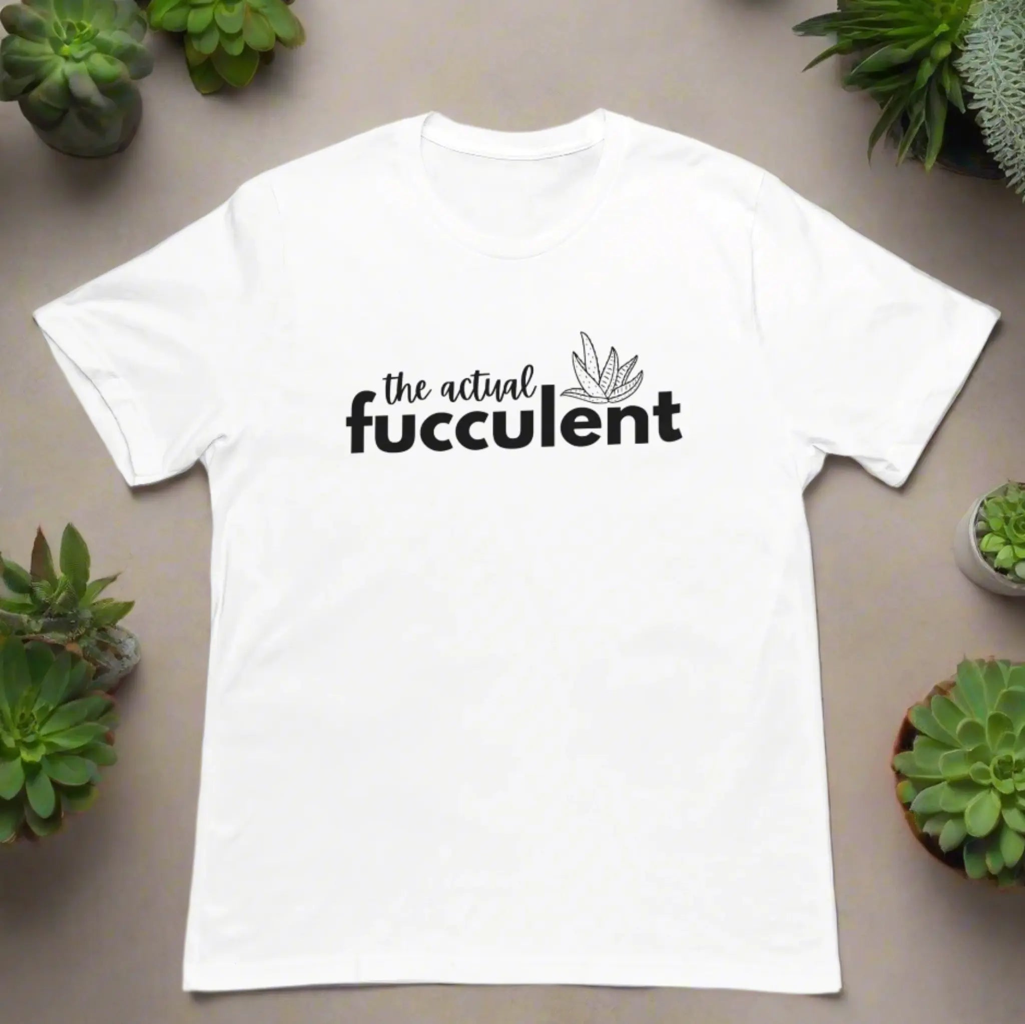 White "The Actual Fucculent" t-shirt flat lay with succulents - funny plant lover tee with succulent pun for gardeners and plant parents