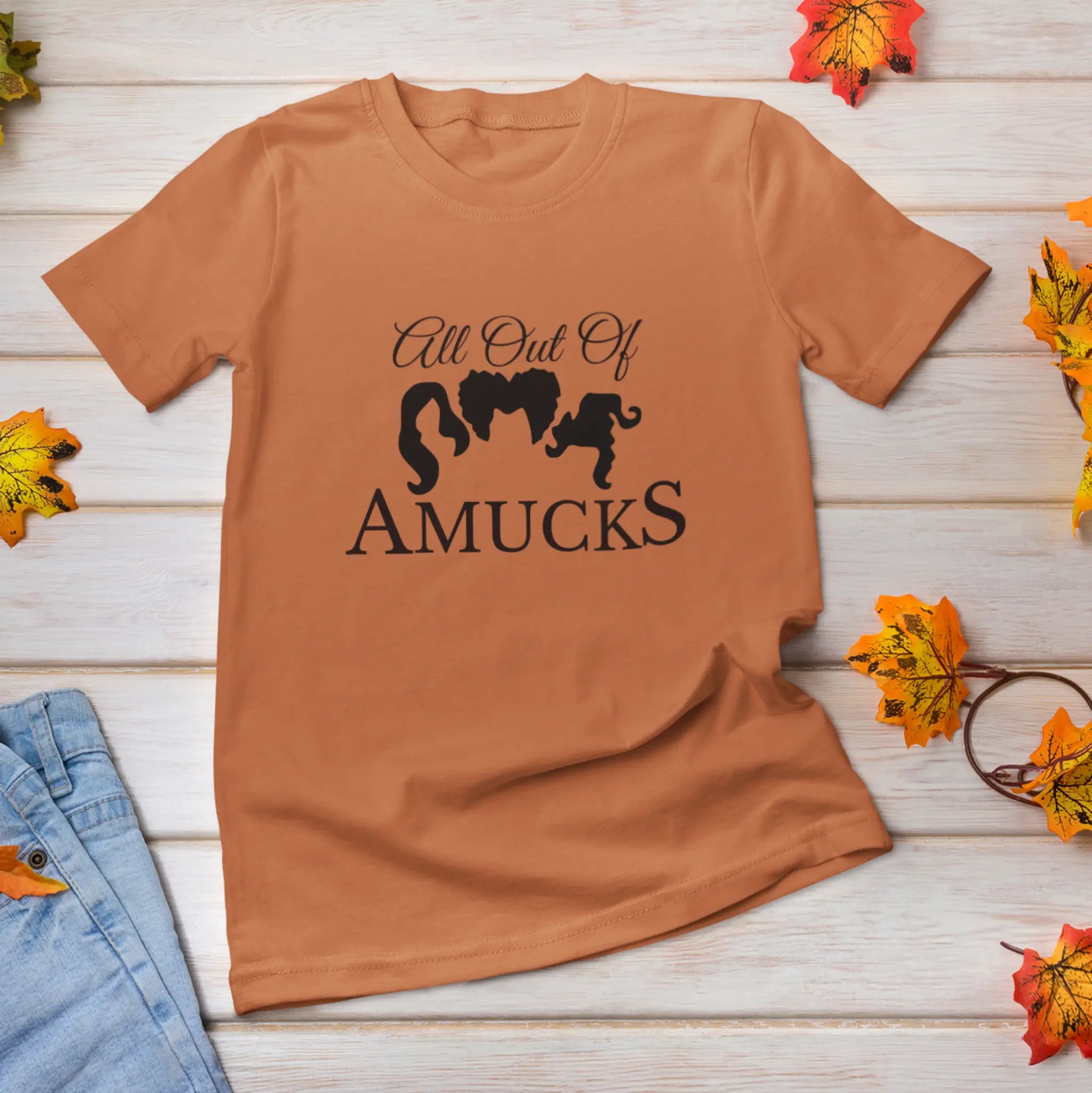 "All Out Of Amucks" charcoal Halloween t-shirt flat lay with fall leaves - Sanderson Sisters Hocus Pocus shirt for Halloween fans and witchy vibes