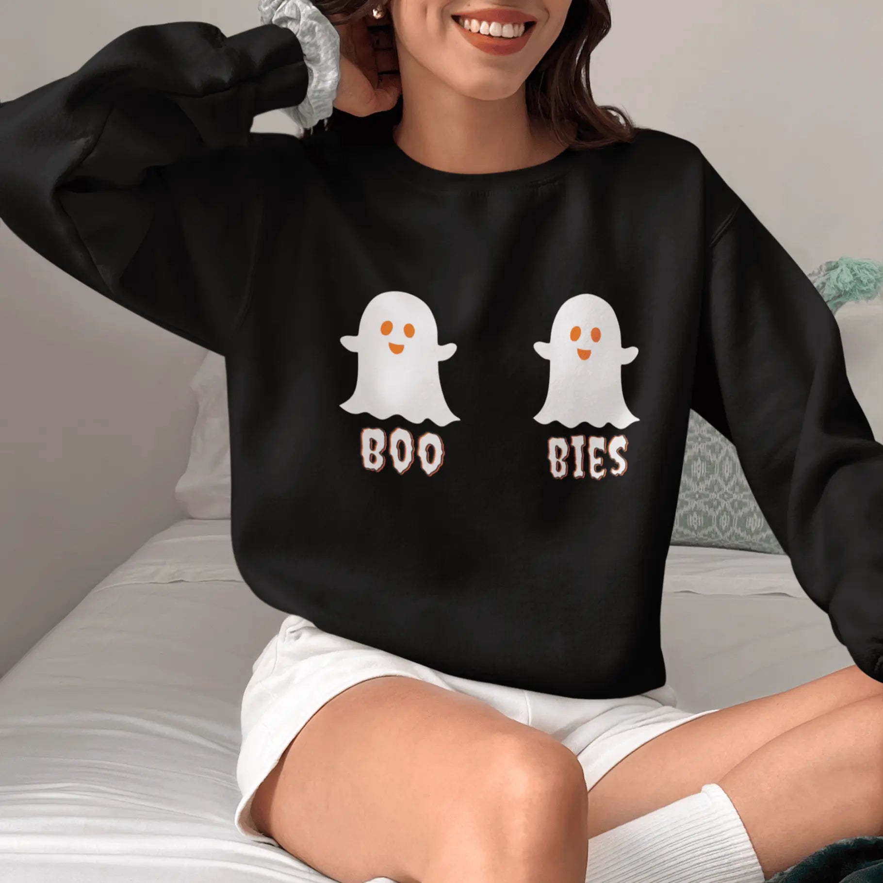 Woman wearing "Boo Bies" Halloween sweatshirt outdoor lifestyle shot - funny ghost boobs sweater for spooky season and Halloween celebrations