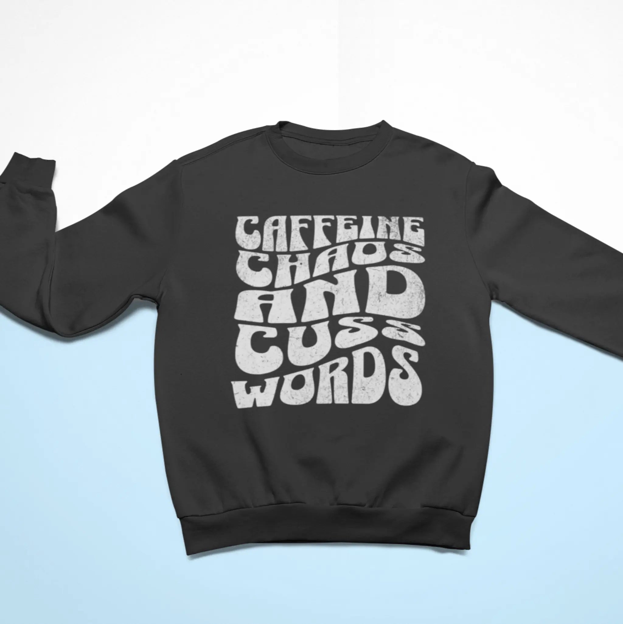 Charcoal "Caffeine Chaos And Cuss Words" crewneck sweatshirt flat lay - funny sarcastic sweater for moms whose life is fueled by caffeine and swearing