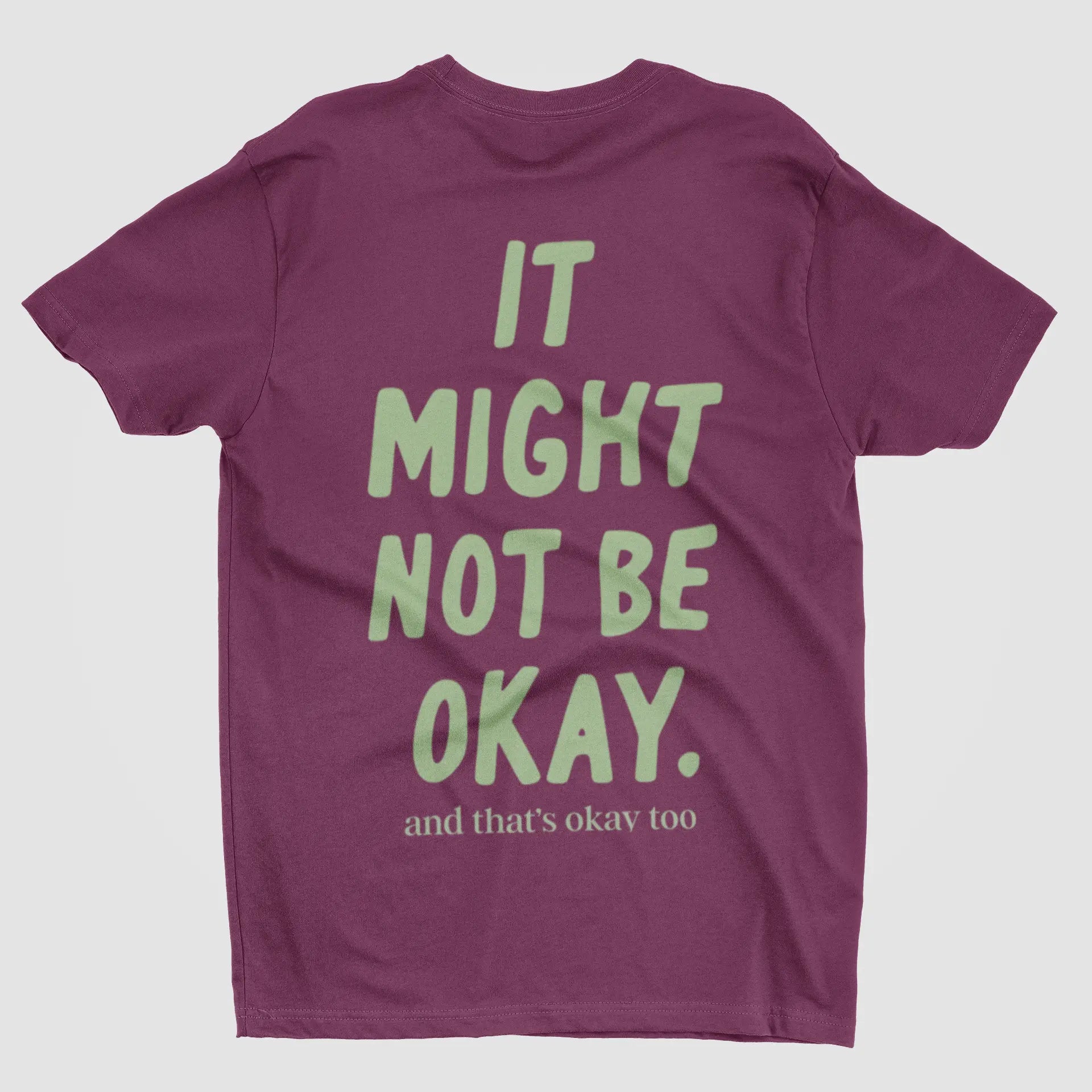 Comfort Colors lifestyle flat lay "It Might Not Be Okay" tee - emotionally fluent sarcastic apparel