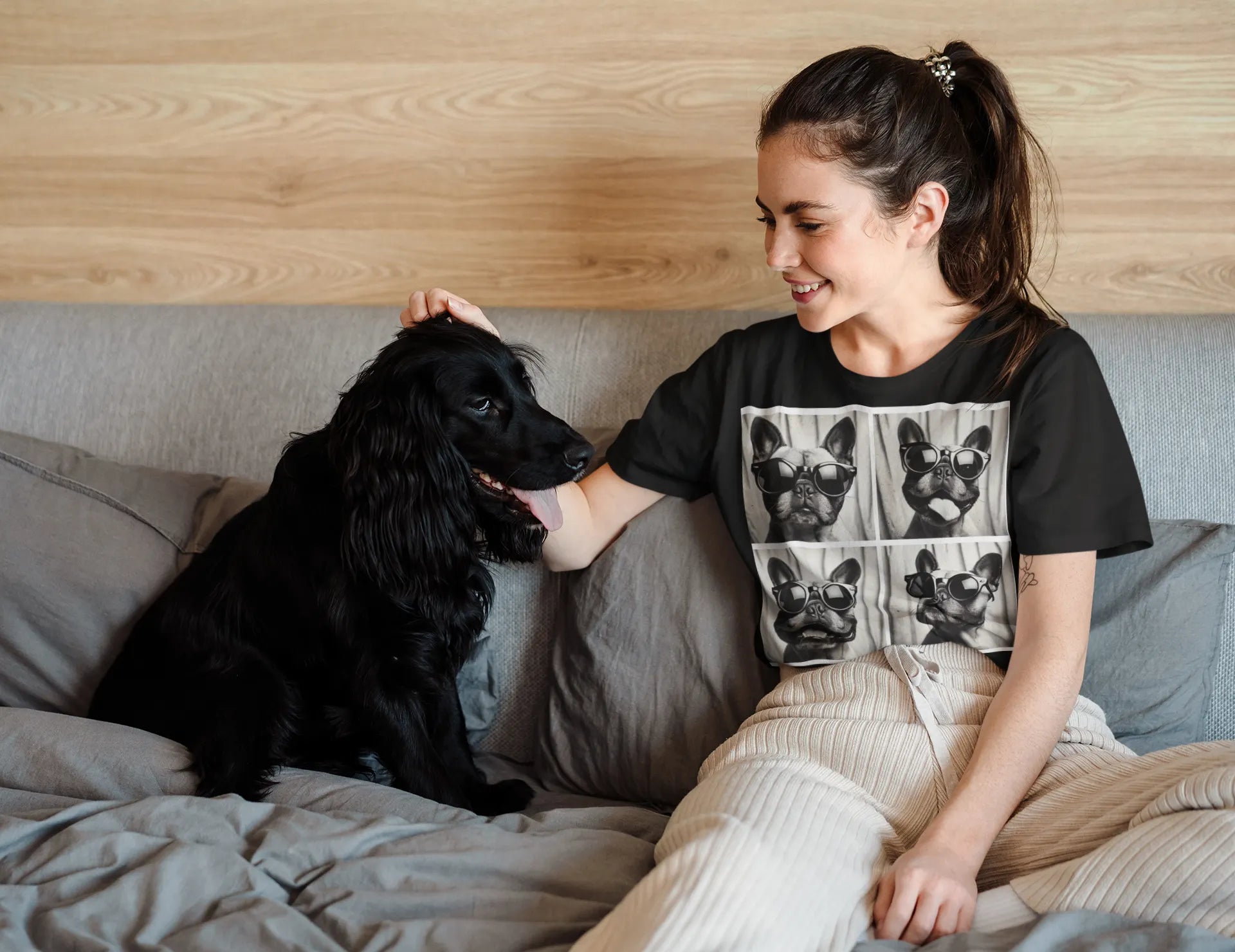 Woman wearing dog lover shirt while petting her dog at home - pet parent tee perfect for dog moms and fur baby lovers