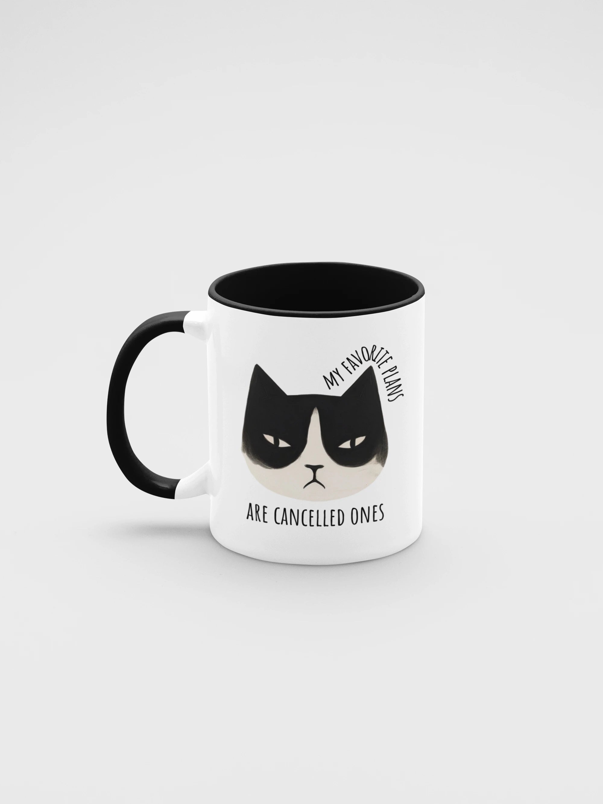 Mug with a cat illustration and text on a white background