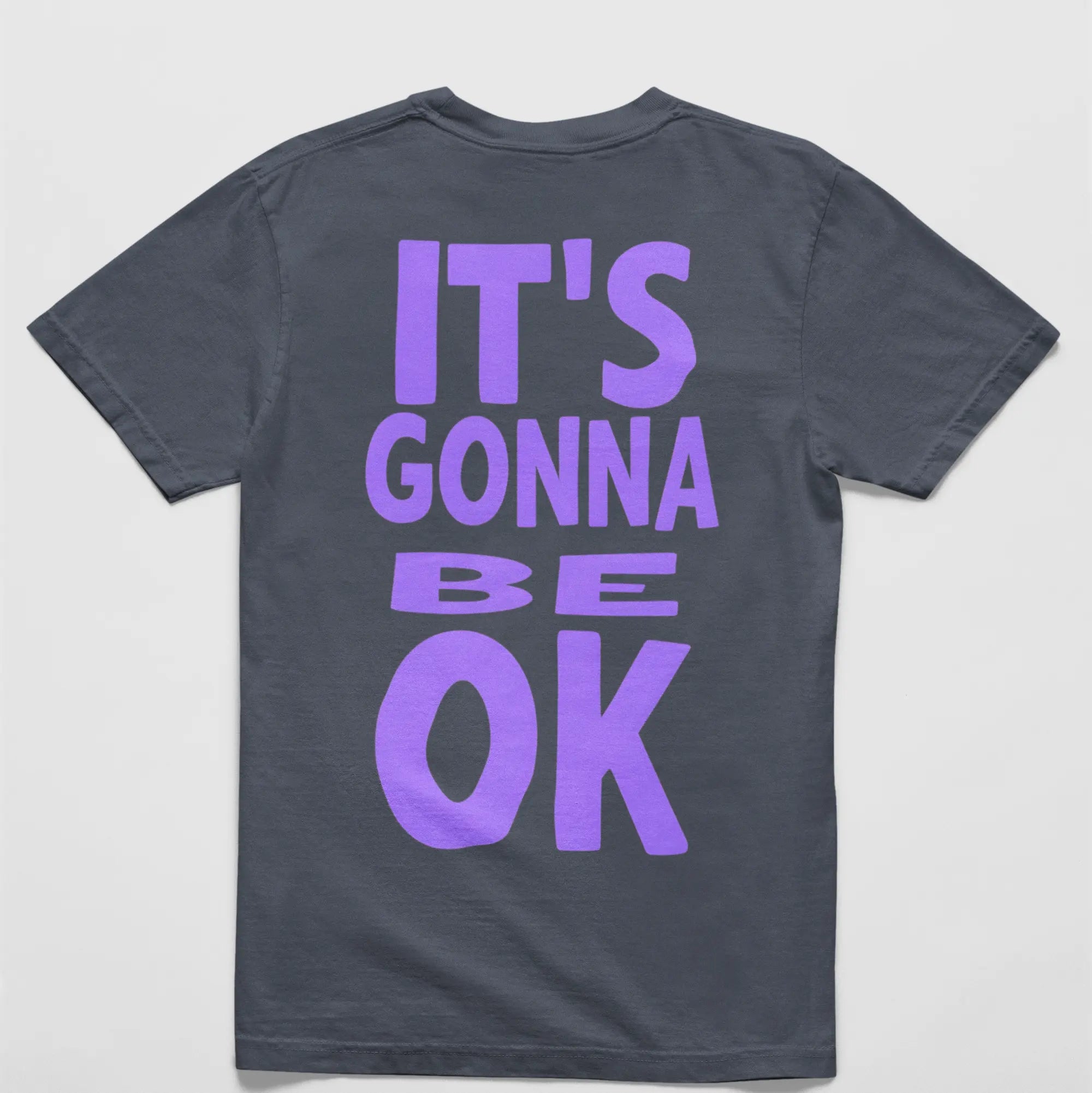 "It's Gonna Be Okay" comfort tee back lifestyle shot - mental health apparel oversized positive message shirt