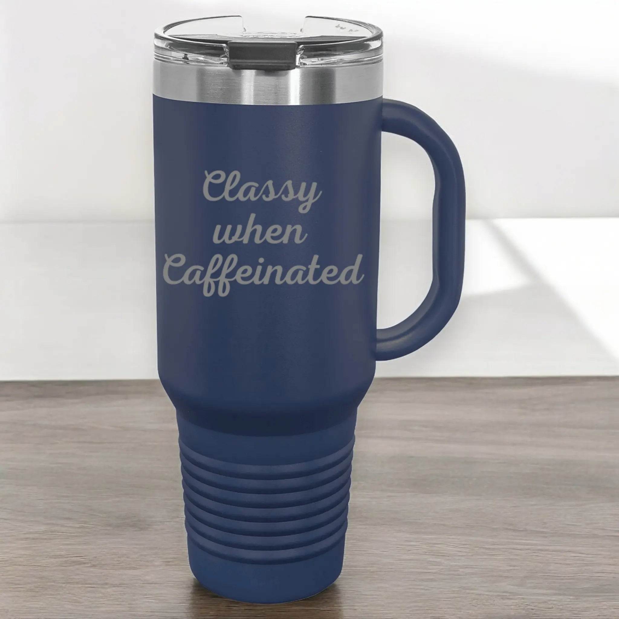 Lifestyle shot of 40oz laser etched "Classy When Caffeinated" tumbler green - coffee cup with handle perfect for caffeine addicts and morning people
