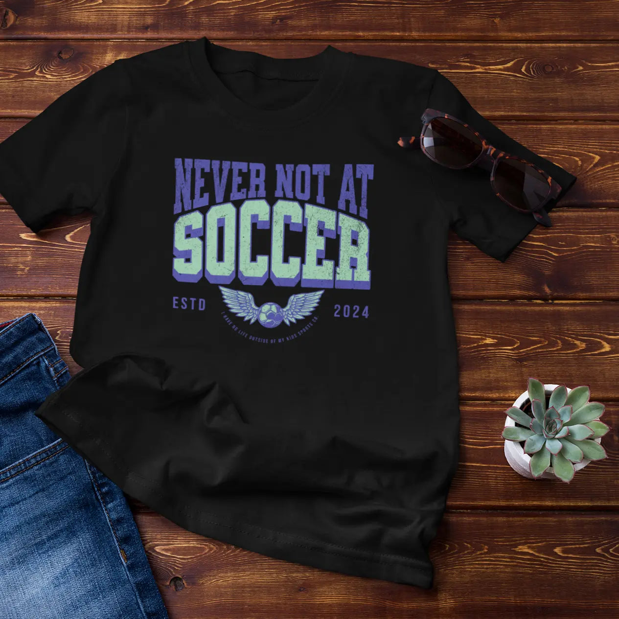 Studio shot "Never Not At Soccer" shirt - sideline parent apparel for moms and dads who know every field in town
