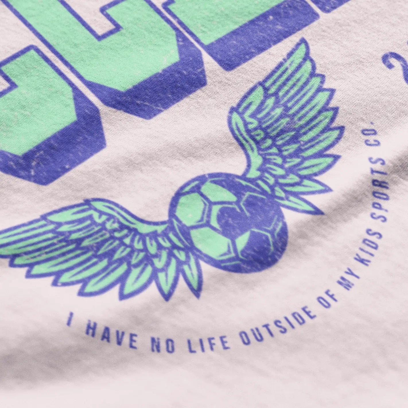 Close-up "Never Not At Soccer" tee on hanger mockup - soccer mom and dad shirt for sideline parents who never leave