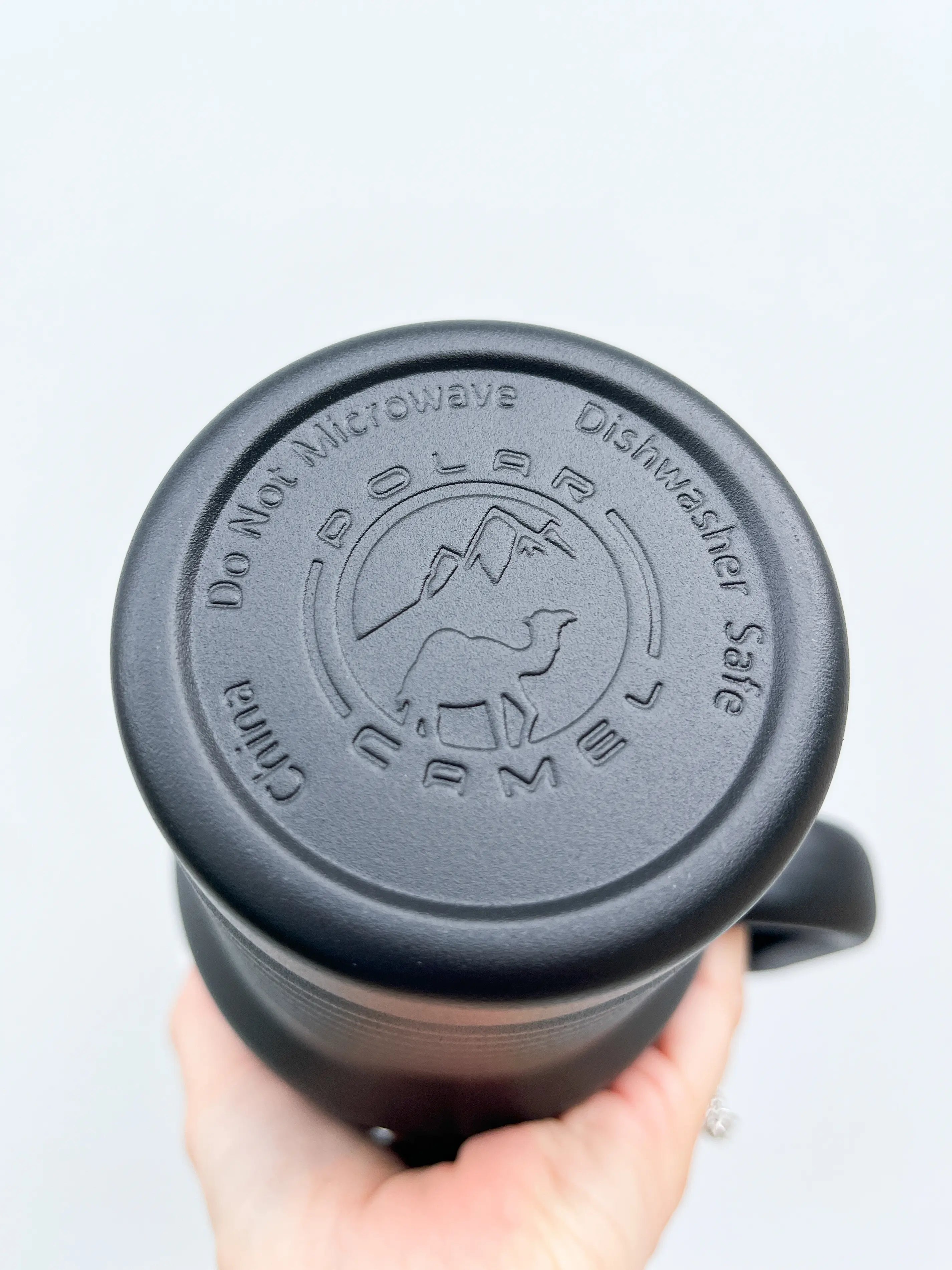 Studio shot of 40oz laser engraved tumbler in black - premium insulated cup with handle for style and function