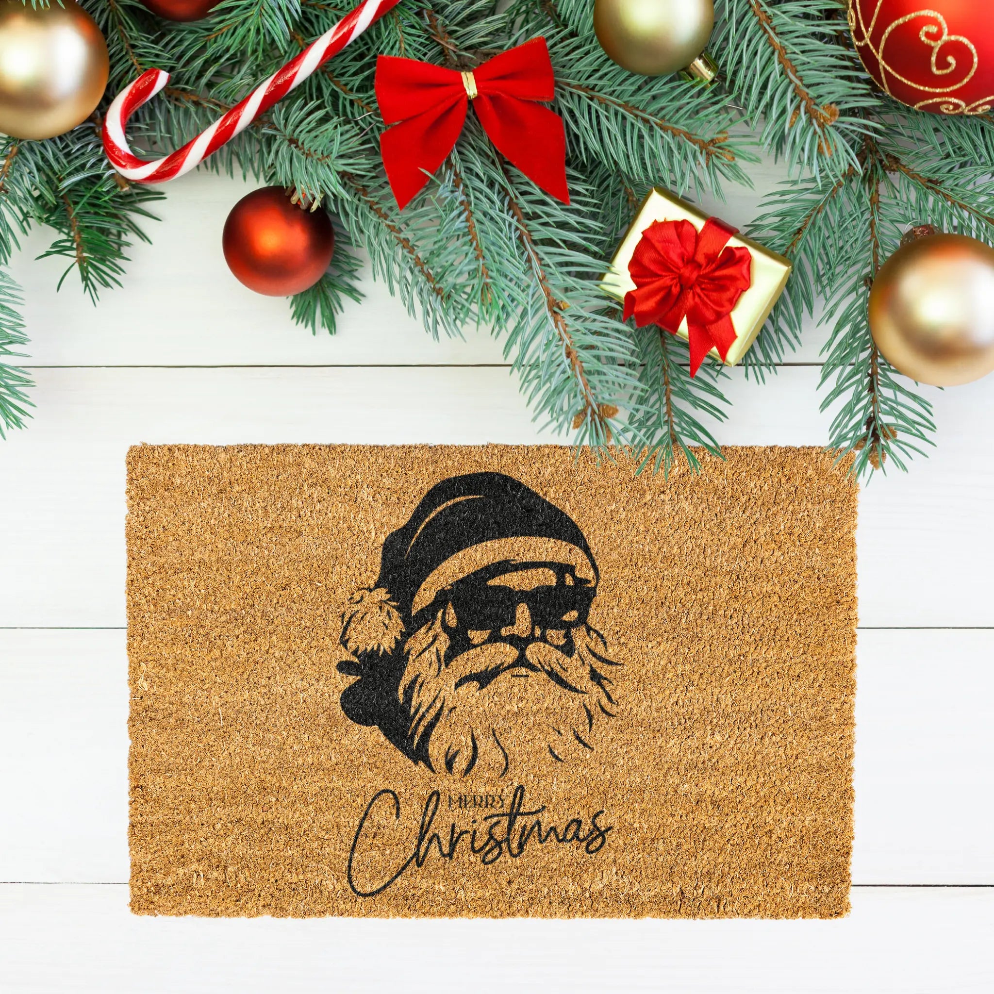 Doormat with Santa Claus design and Christmas decorations on a wooden floor