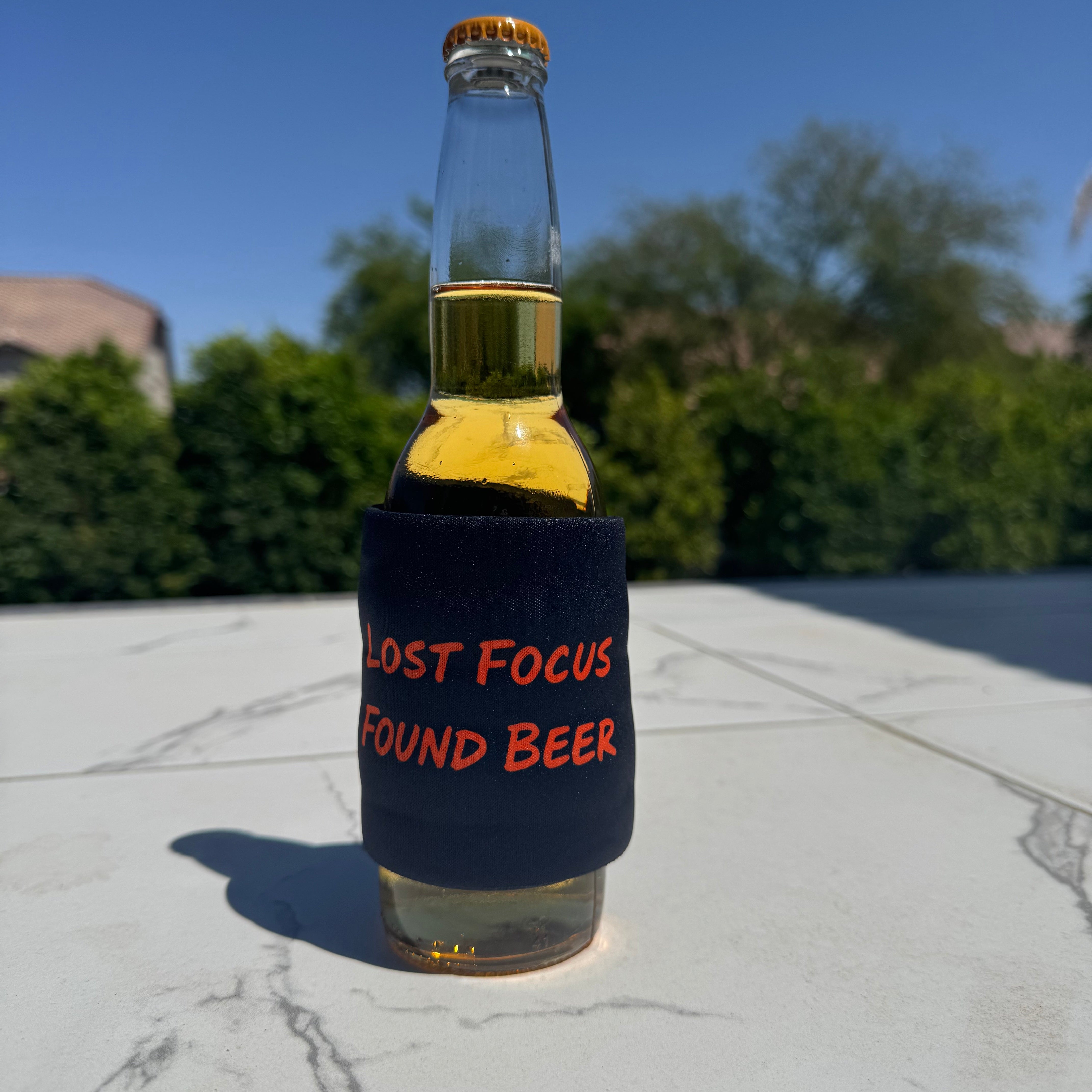 Funny slap wrap koozie with “Lost Focus Found Beer” saying for distracted drinkers, beer bottle wrap