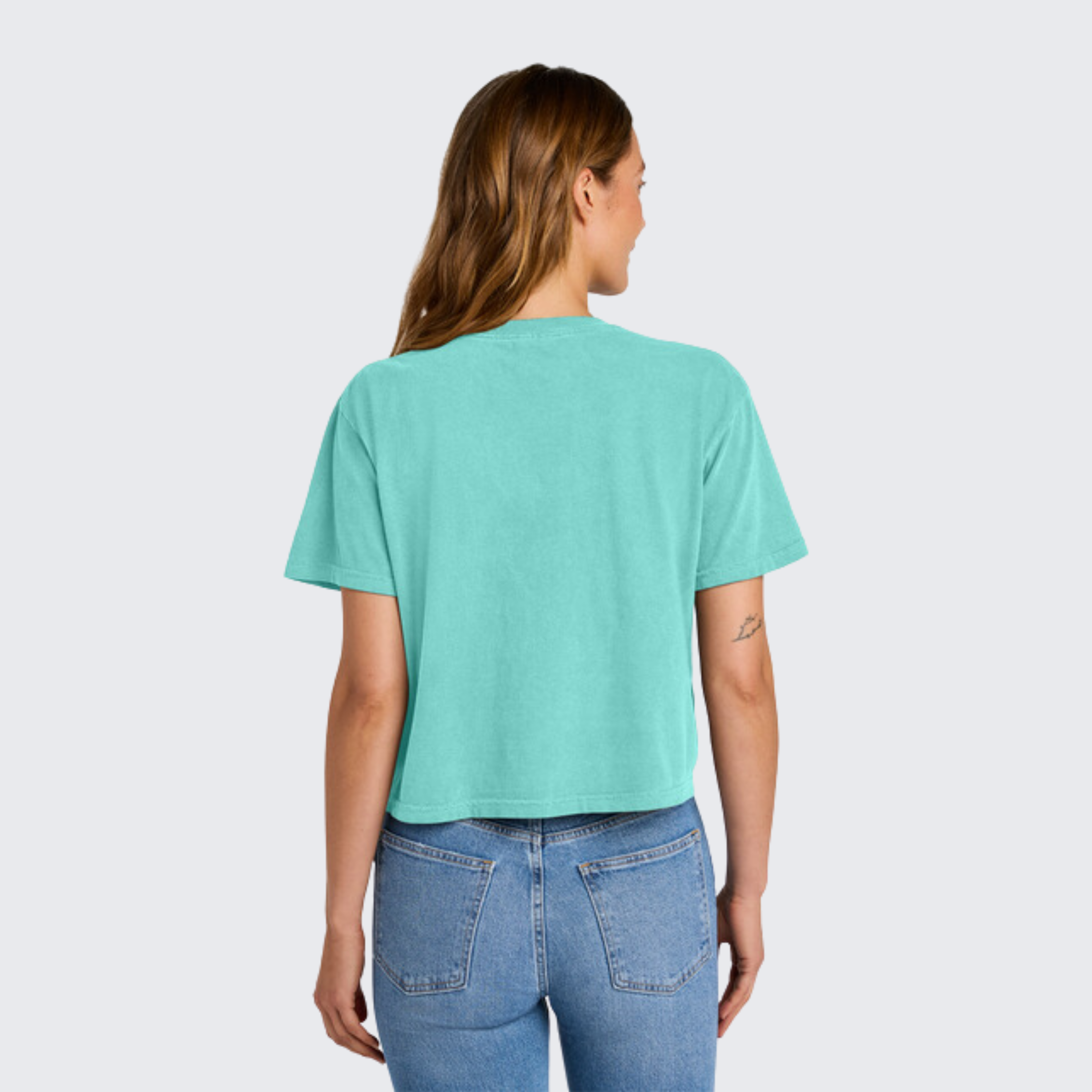 Back view of Teal boxy shirt on model Moms Against White Pants' Comfort Colors tee for sports moms tired of washing their kids' stained baseball and football pants