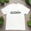 White "The Actual Fucculent" t-shirt flat lay with succulents - funny plant lover tee with succulent pun for gardeners and plant parents