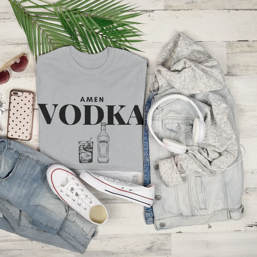 Flat lay of "Amen Vodka" t-shirt with jeans - funny drinks tee featuring vodka bottle and cocktail graphic, perfect for parties