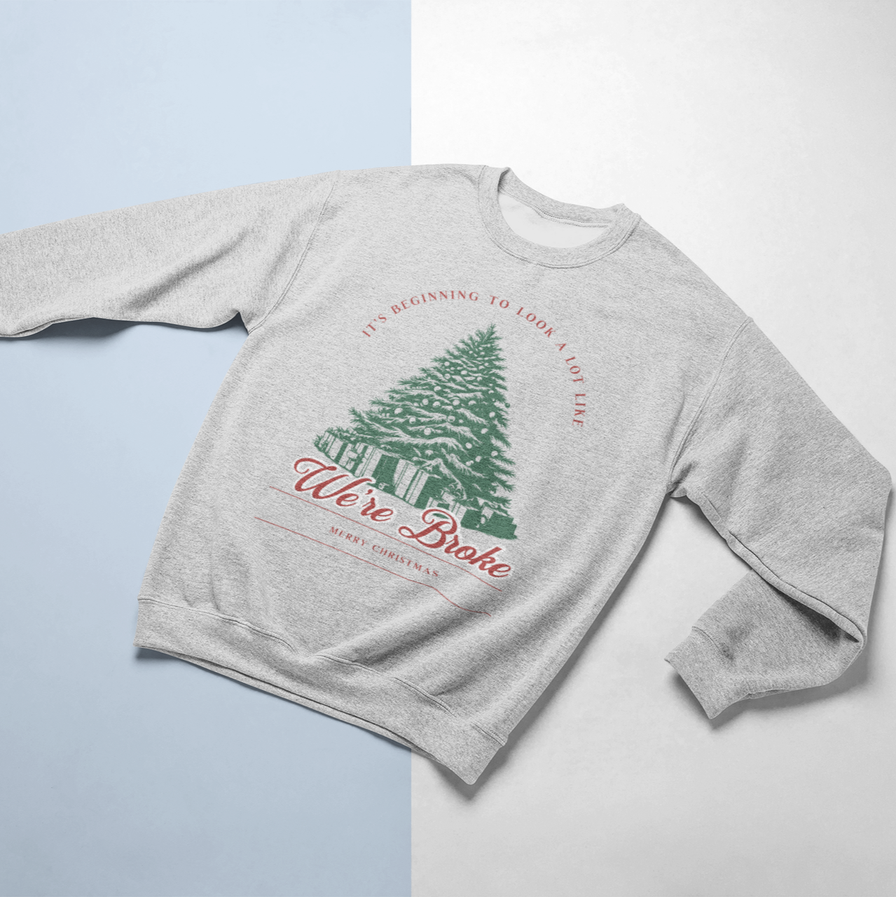 Funny Christmas crewneck sweatshirt with the phrase 'It's Beginning to Look a Lot Like We're Broke,' featuring a festive Christmas tree design, perfect for humorous holiday style