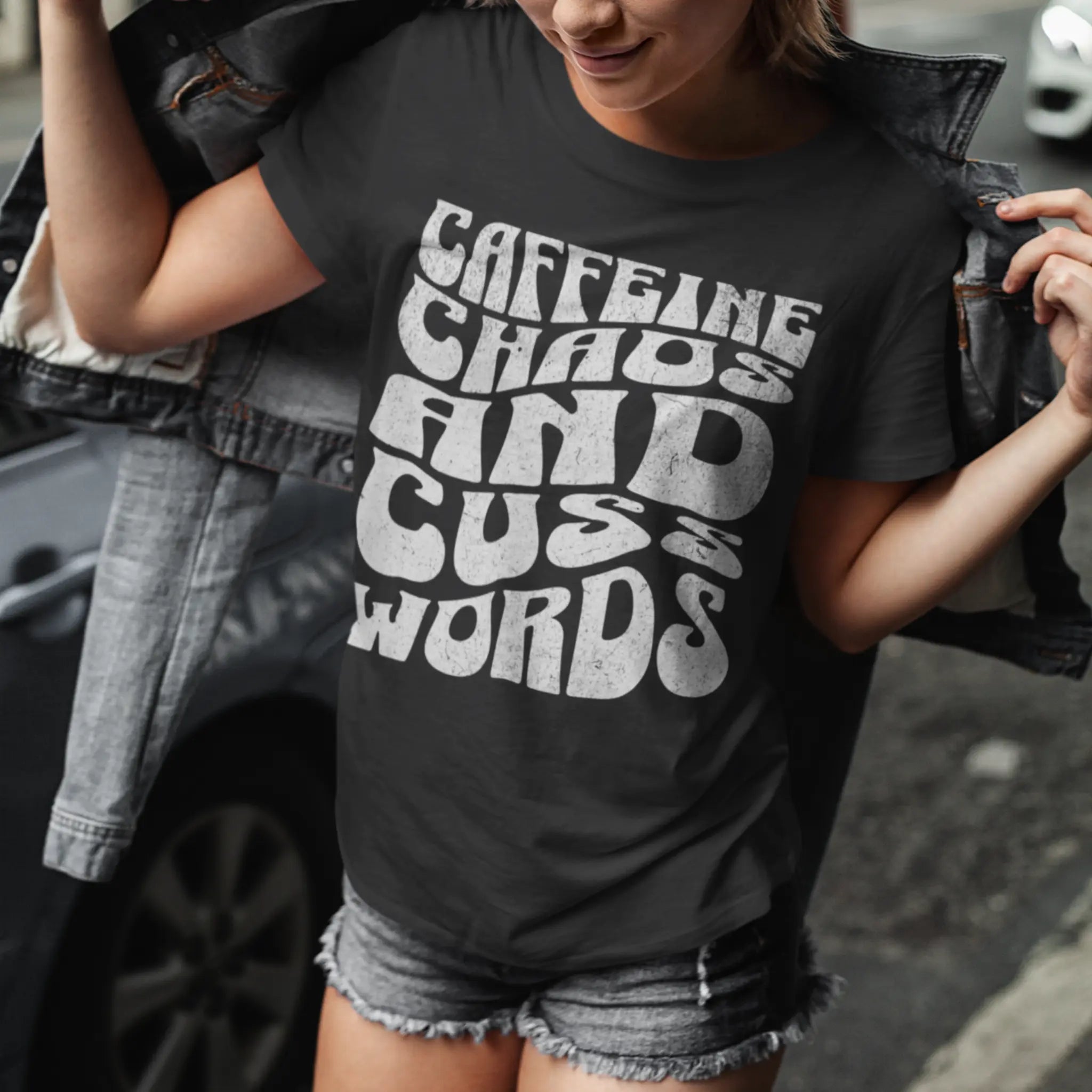 Woman wearing black "Caffeine Chaos And Cuss Words" t-shirt - funny attitude tee for moms whose life is fueled by caffeine and profanity