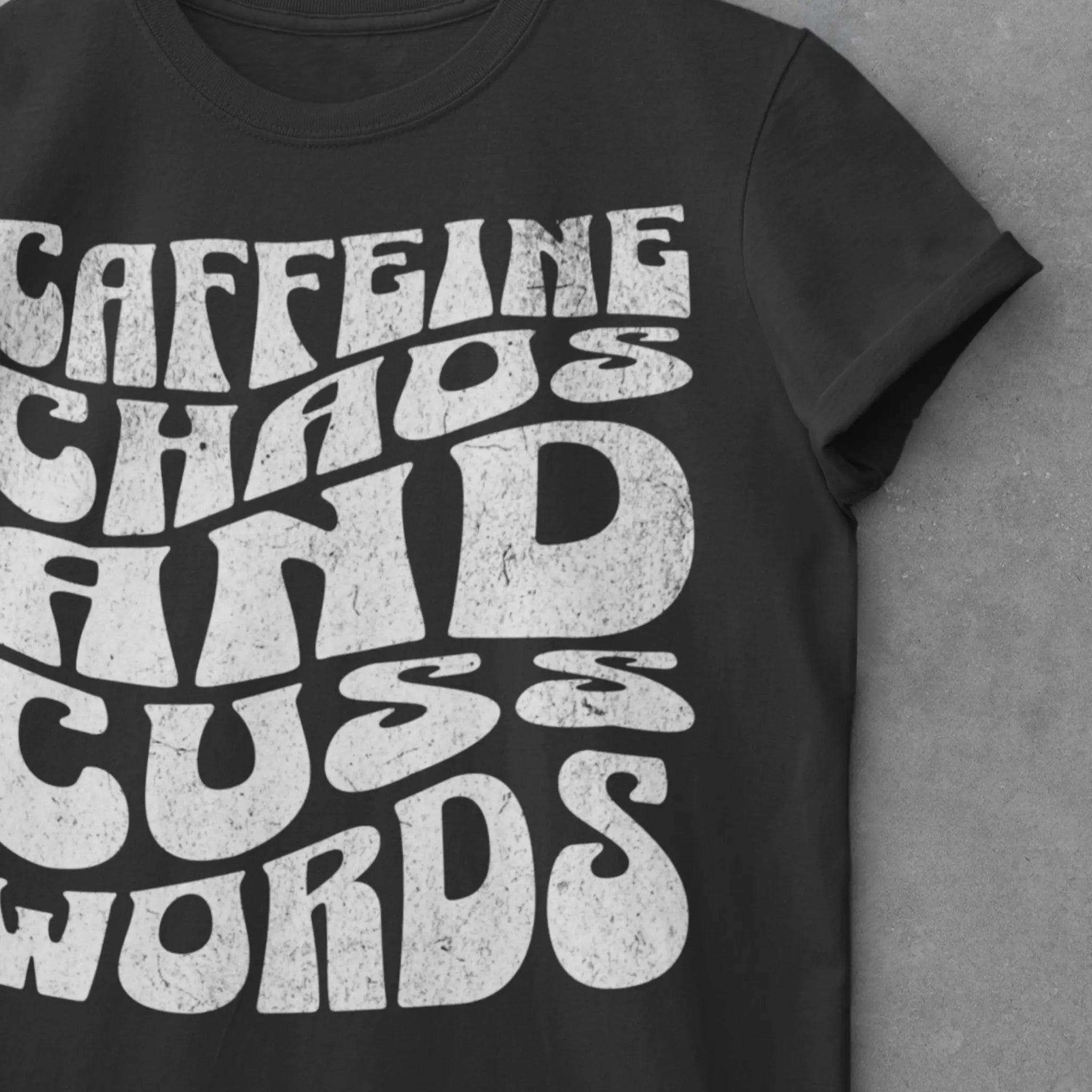 Lifestyle shot of "Caffeine Chaos And Cuss Words" t-shirt - funny mom humor shirt for parents surviving chaos with coffee and cuss words