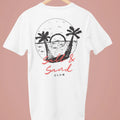 White t-shirt with small “Salt & Sand Club” script logo on front left chest, minimalist beach tee