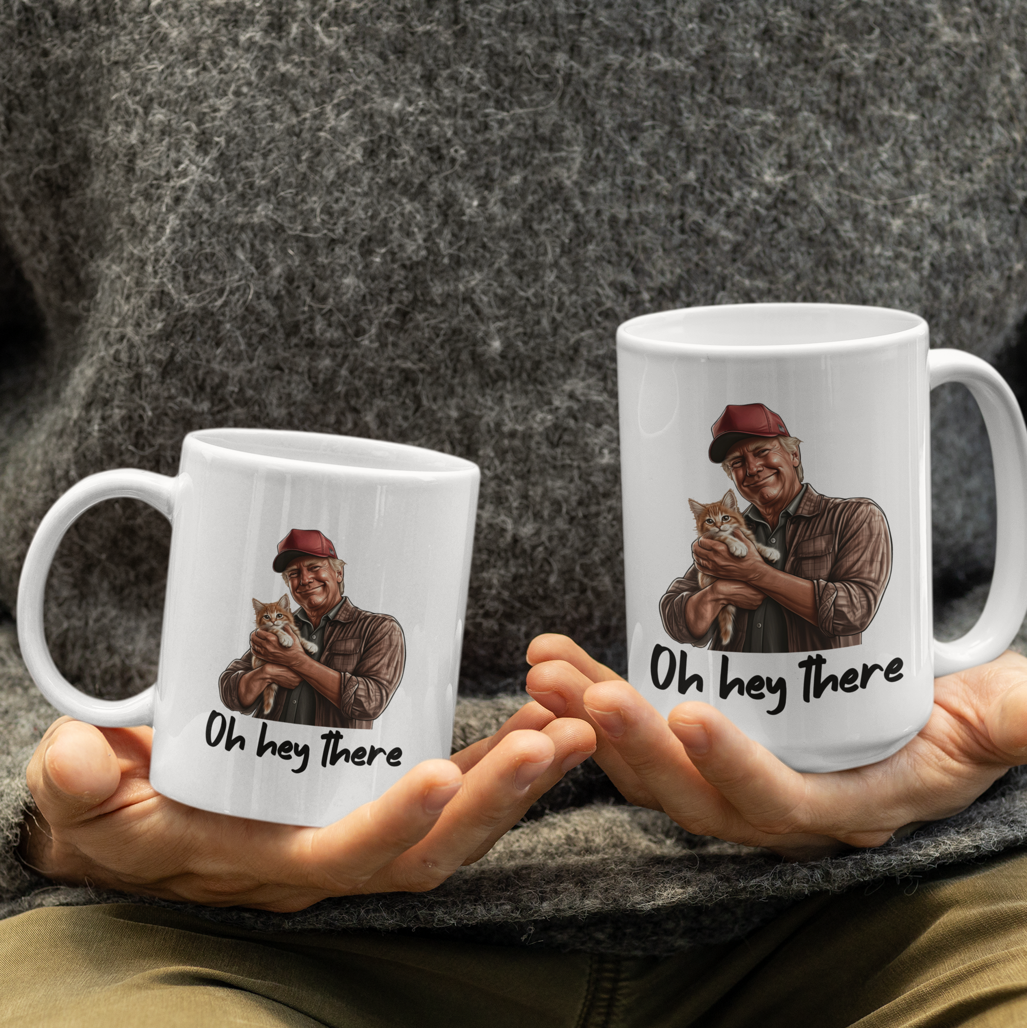 White 'Oh Hey There' coffee mug featuring Trump holding a cat, available in 11 oz and 15 oz sizes with a durable ceramic design and blue handle.