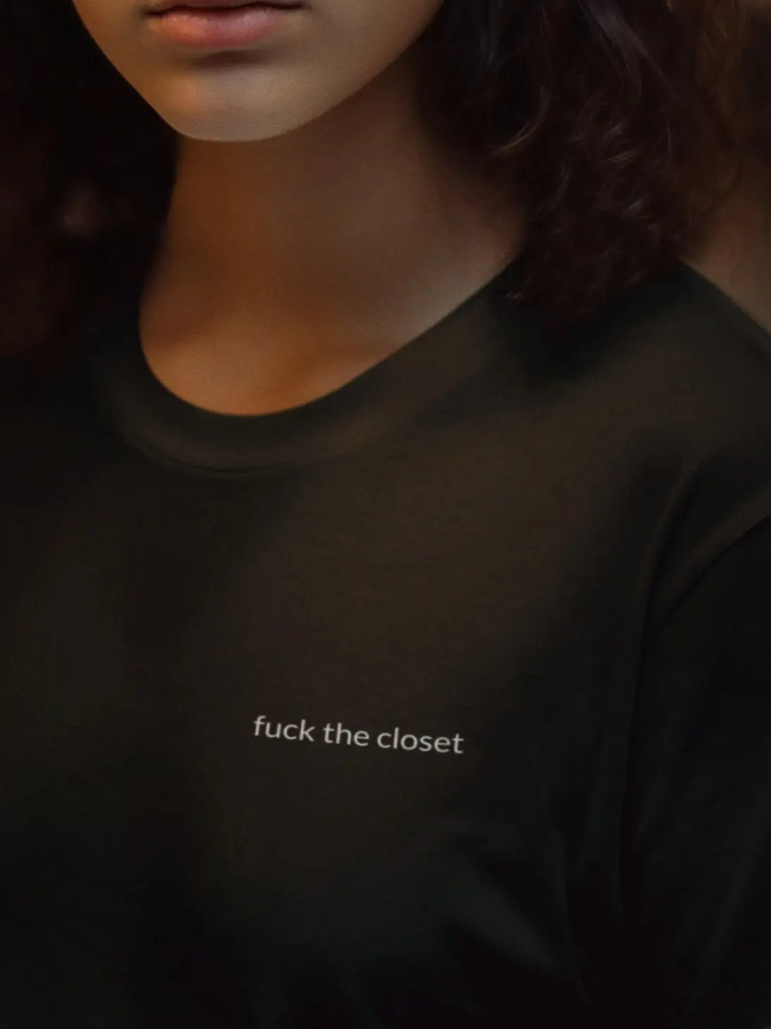 Black unisex t-shirt with vertical “fuck the closet” front print, pride ally LGBTQ apparel
