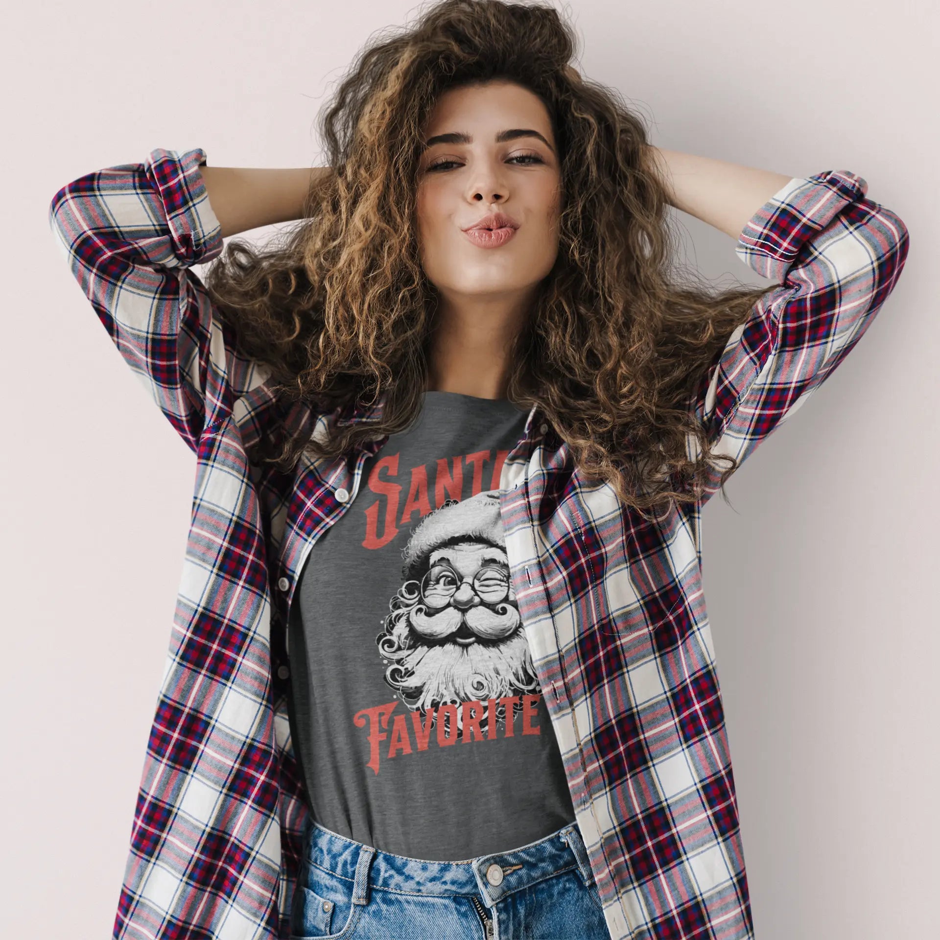 Funny holiday t-shirt for women and men with Santa graphic and “Santa’s Favorite!” Christmas phrase