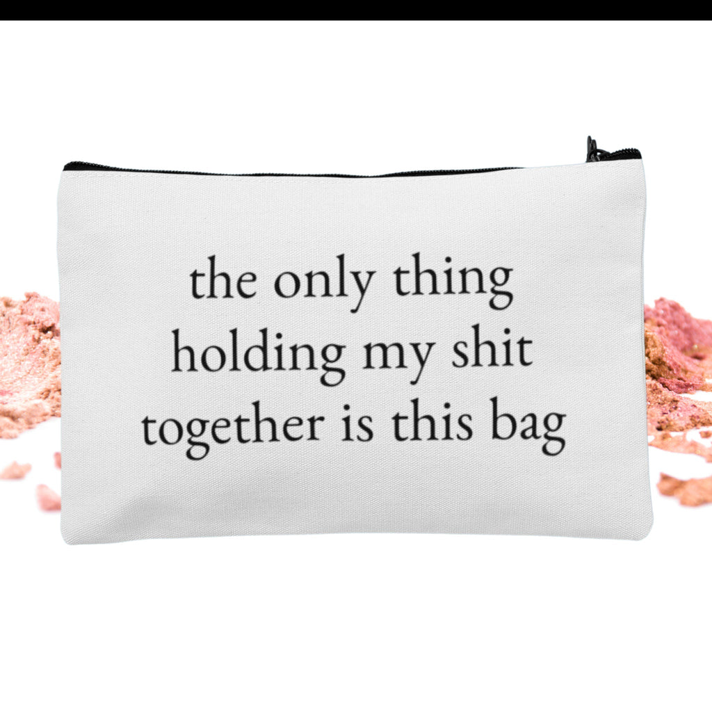 A custom makeup bag with the phrase 'The Only Thing Holding My Shit Together Is This Bag,' making it a funny and practical gift for women. Perfect for those looking for unique and humorous cosmetic bags.