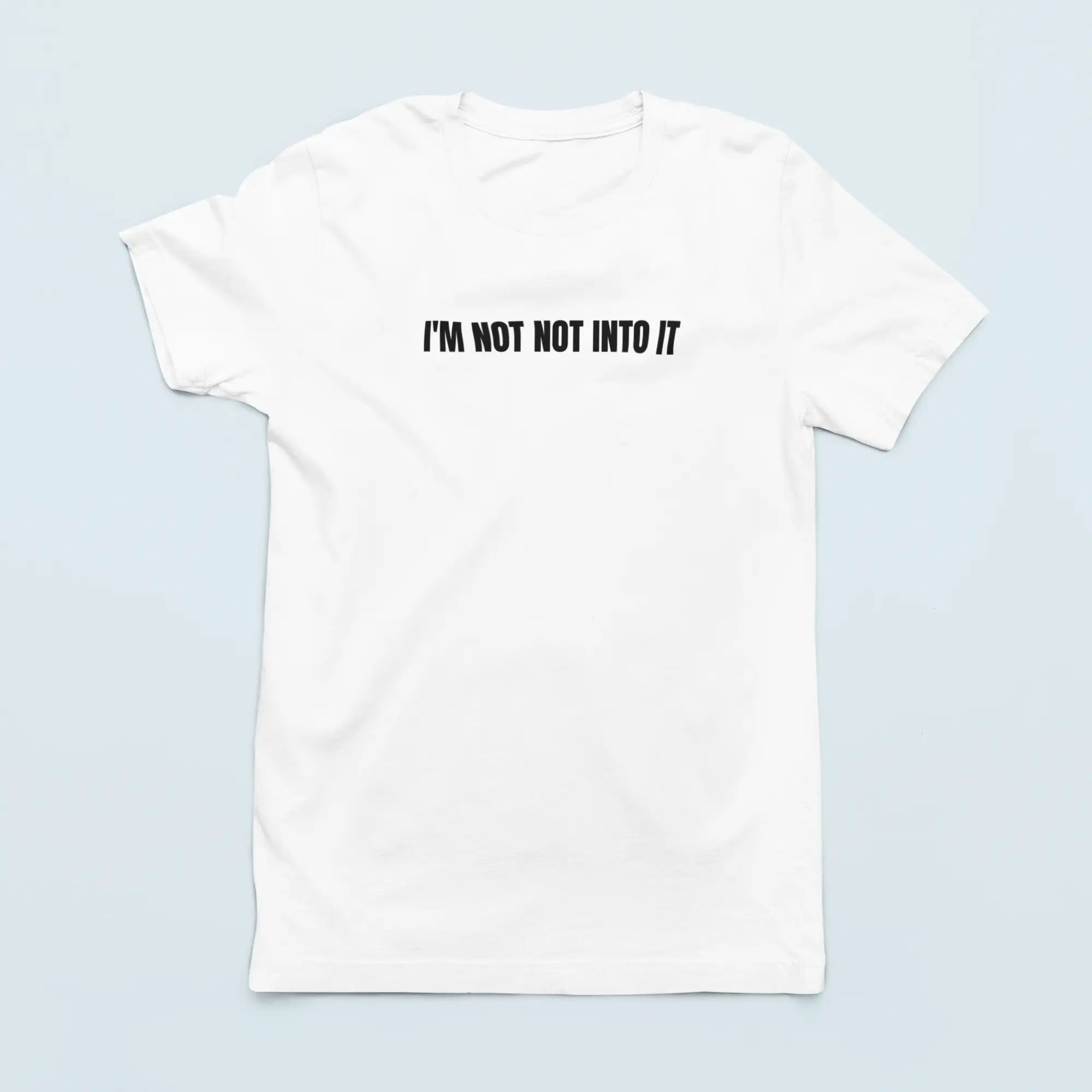 Flat lay "I'm Not Not Into It" Bella Canvas shirt - witty apparel for people who embrace ambivalence with style