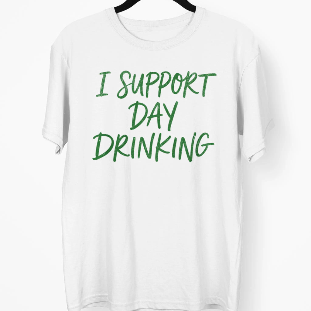 White graphic t-shirt reading “I Support Day Drinking” in green, funny Irish holiday bar crawl shirt
