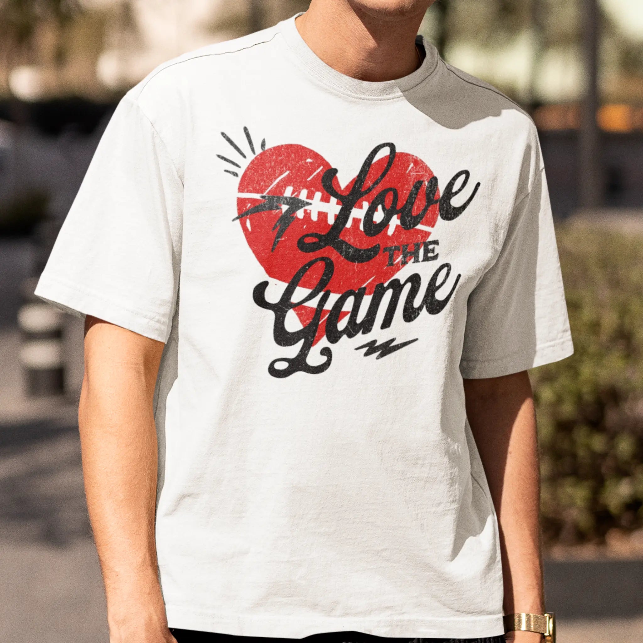 “Love the Game” football shirt with heart design, unisex game day t-shirt for football lovers