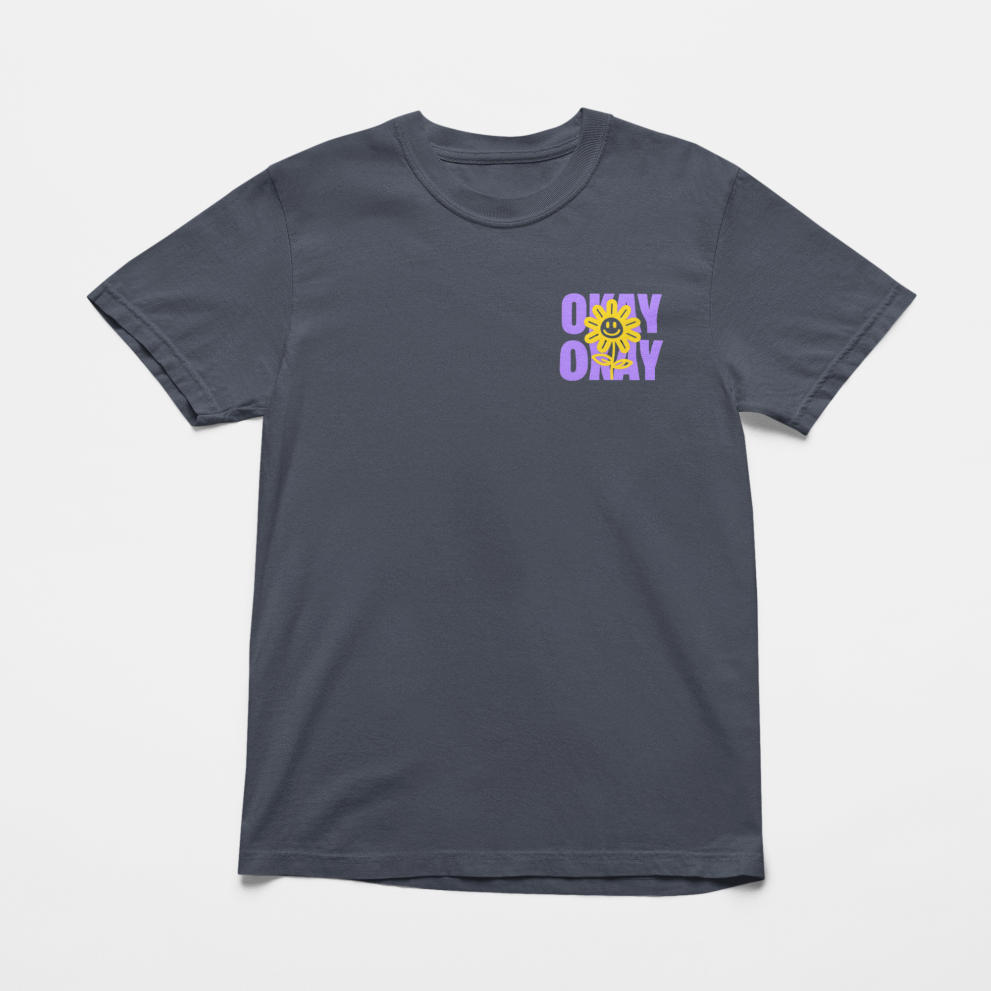 Oversized navy front tee with "It’s Gonna Be OK" printed in bold purple text on the back, styled for casual and confident comfort.