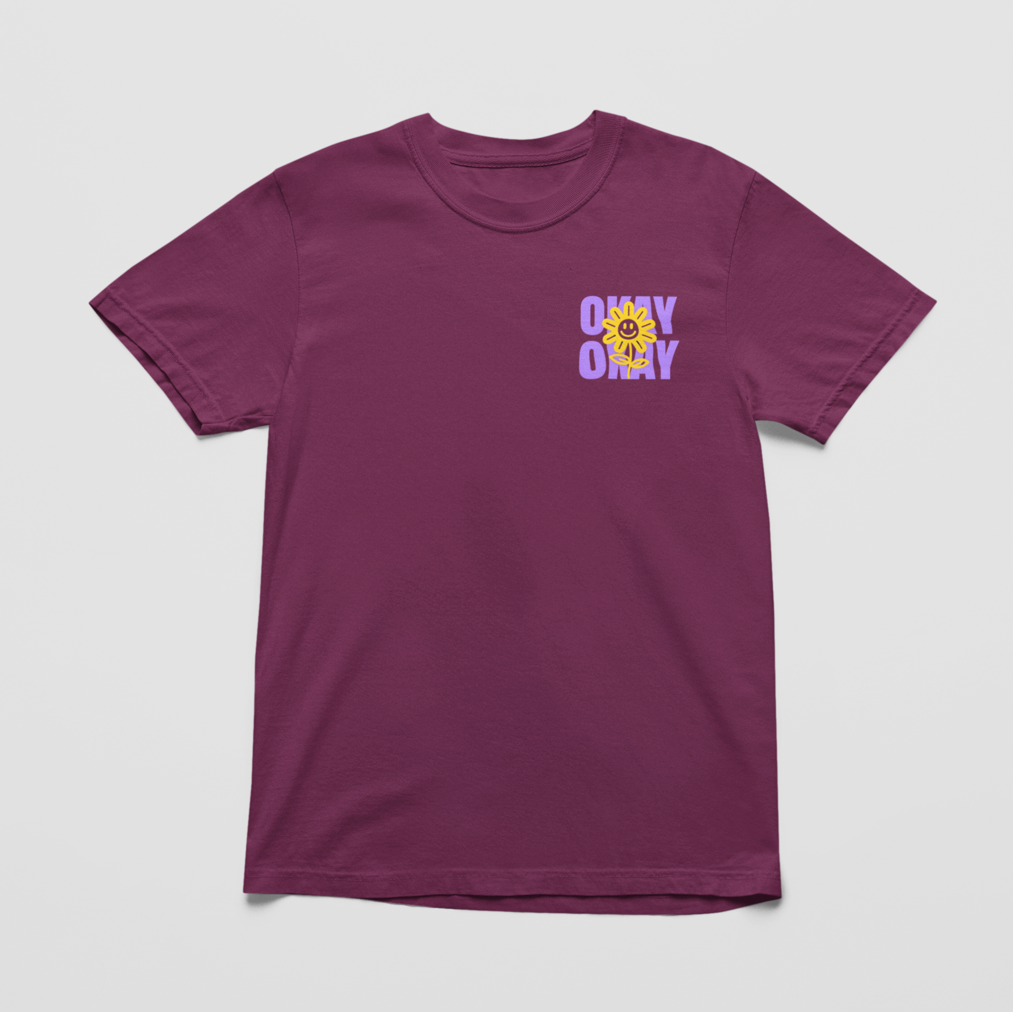 vineyard front Oversized black tee with "It’s Gonna Be OK" printed in bold purple text on the back, styled for casual and confident comfort.