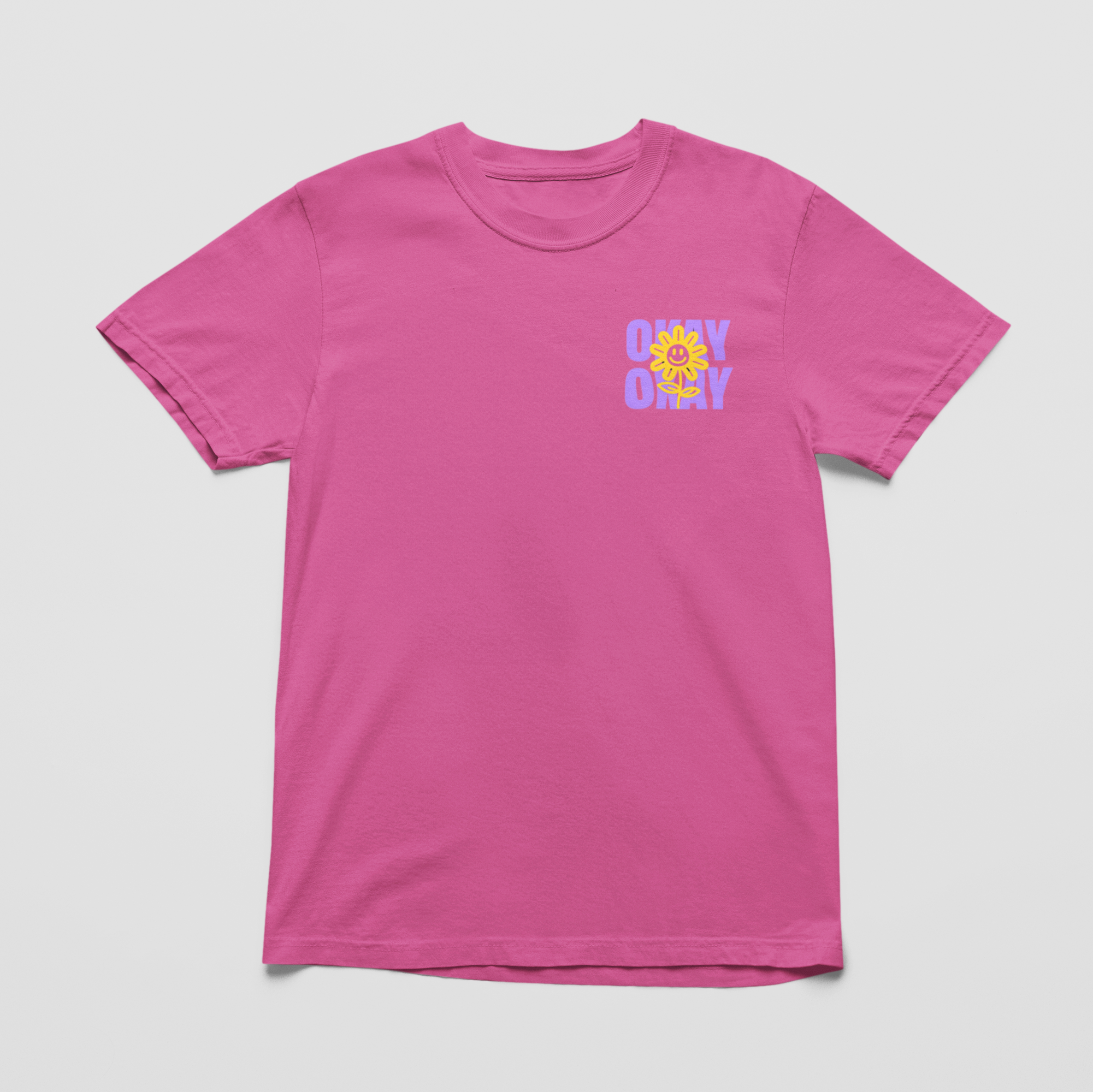Neon pink Oversized black tee with "It’s Gonna Be OK" printed in bold purple text on the back, styled for casual and confident comfort.