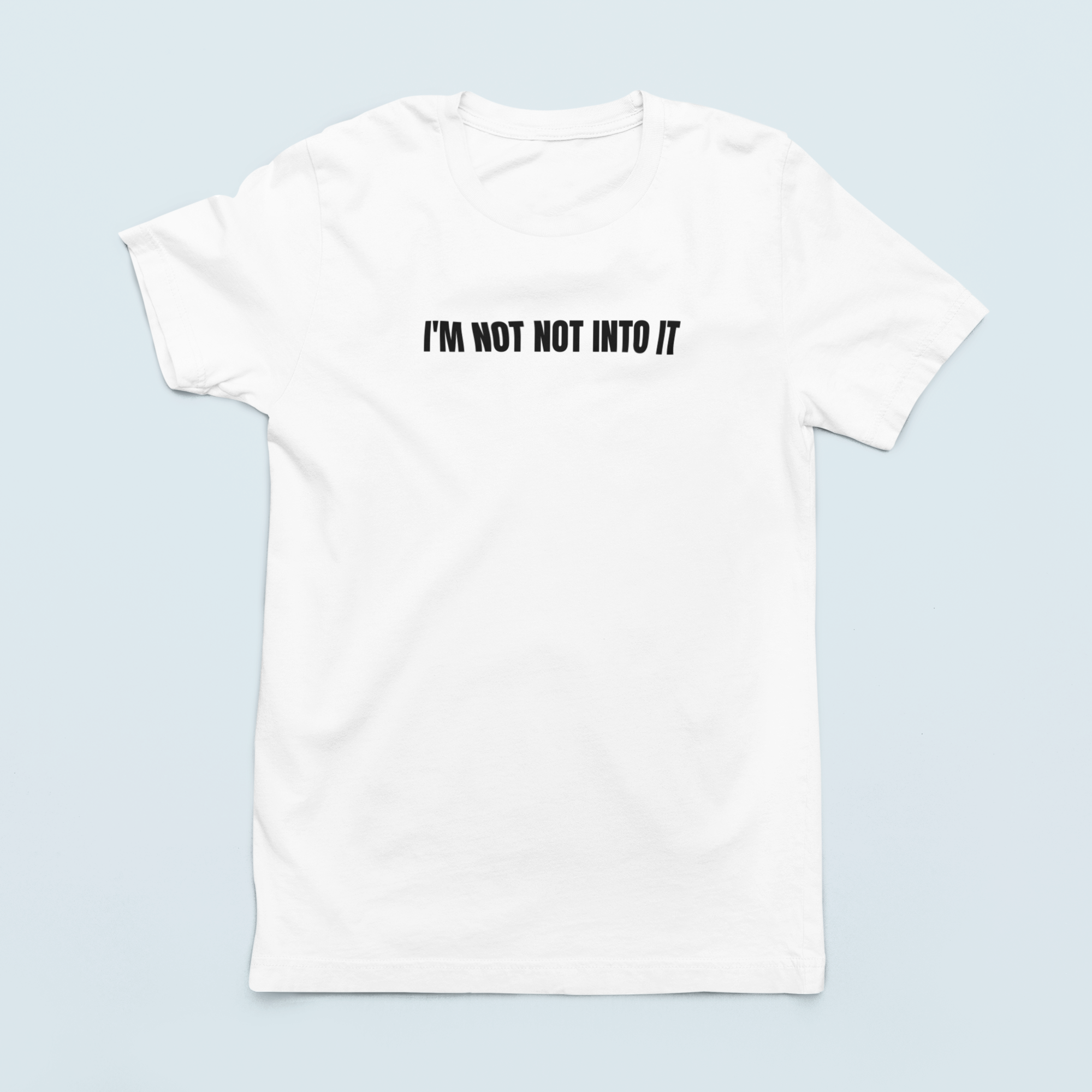 White Lay flat 'I'm Not Not Into It' soft black tee featuring bold text design, perfect for casual and stylish everyday wear