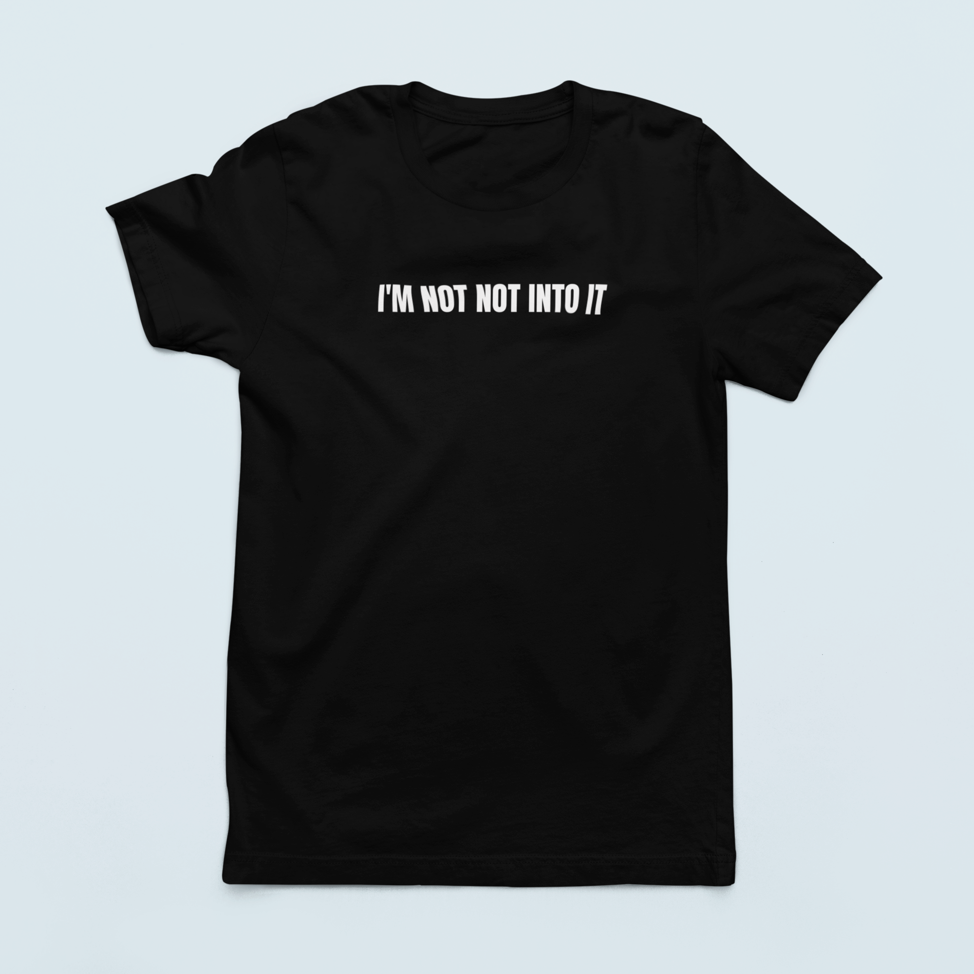 Black lay flat 'I'm Not Not Into It' soft black tee featuring bold text design, perfect for casual and stylish everyday wear