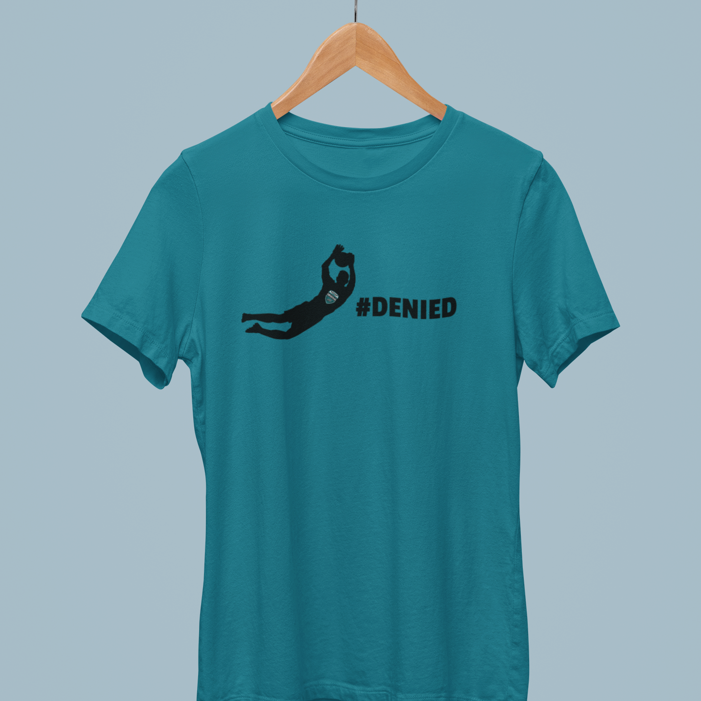 Teal Soccer-themed shirt featuring a diving goalkeeper and the hashtag #DENIED, perfect for soccer lovers and goalkeepers