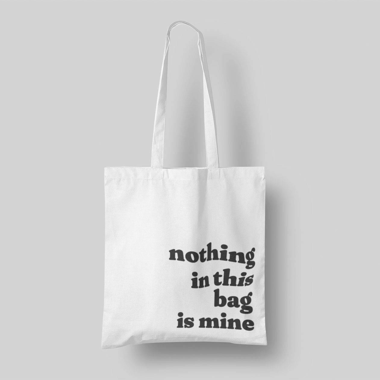 black text 'Nothing in This Bag is Mine' cotton canvas tote, 15x16 inches, with multi-color text, perfect for hauling everyone else’s stuff