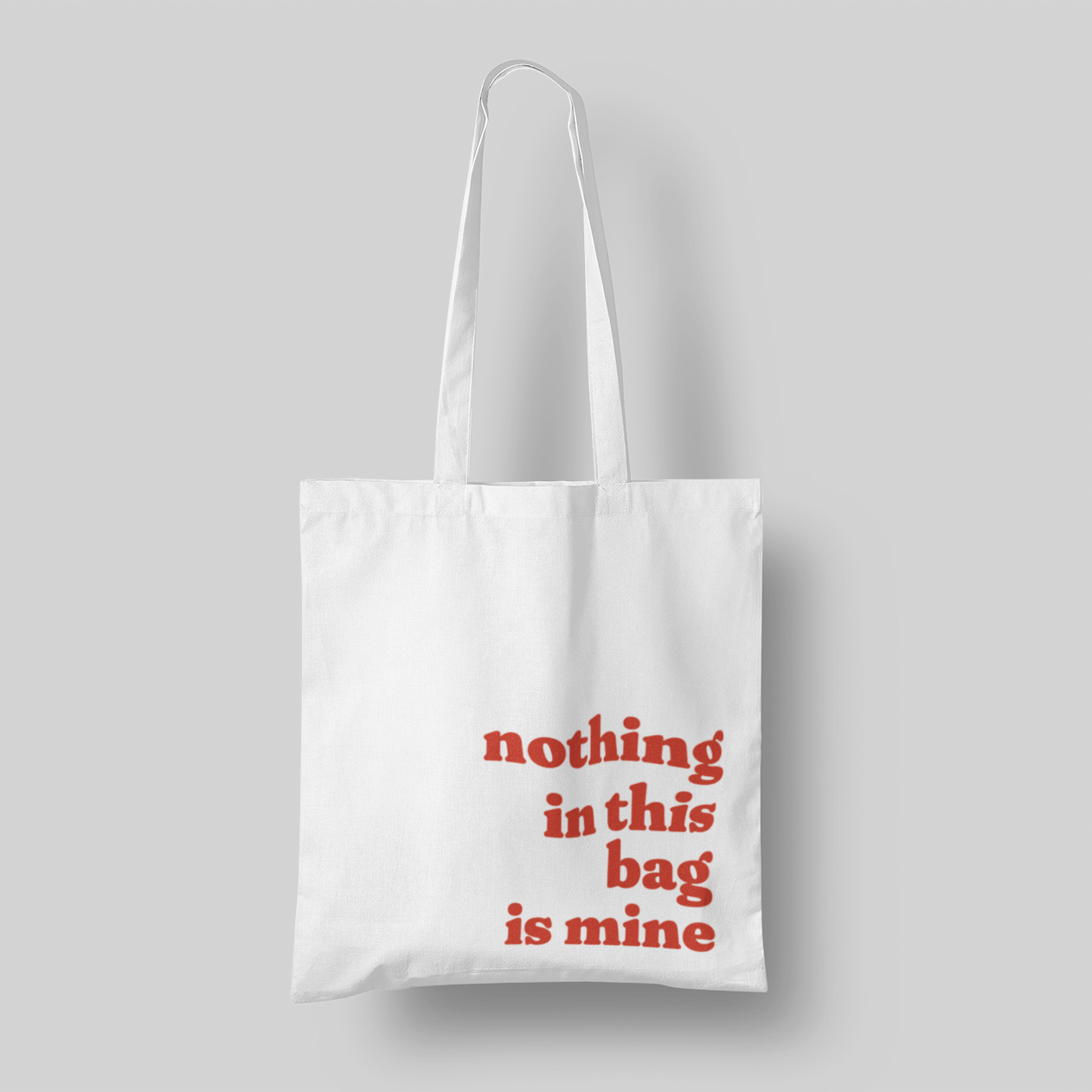 Red text 'Nothing in This Bag is Mine' cotton canvas tote, 15x16 inches, with multi-color text, perfect for hauling everyone else’s stuff