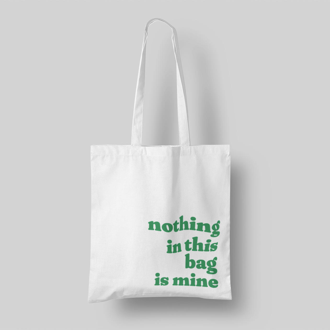 green text 'Nothing in This Bag is Mine' cotton canvas tote, 15x16 inches, with multi-color text, perfect for hauling everyone else’s stuff