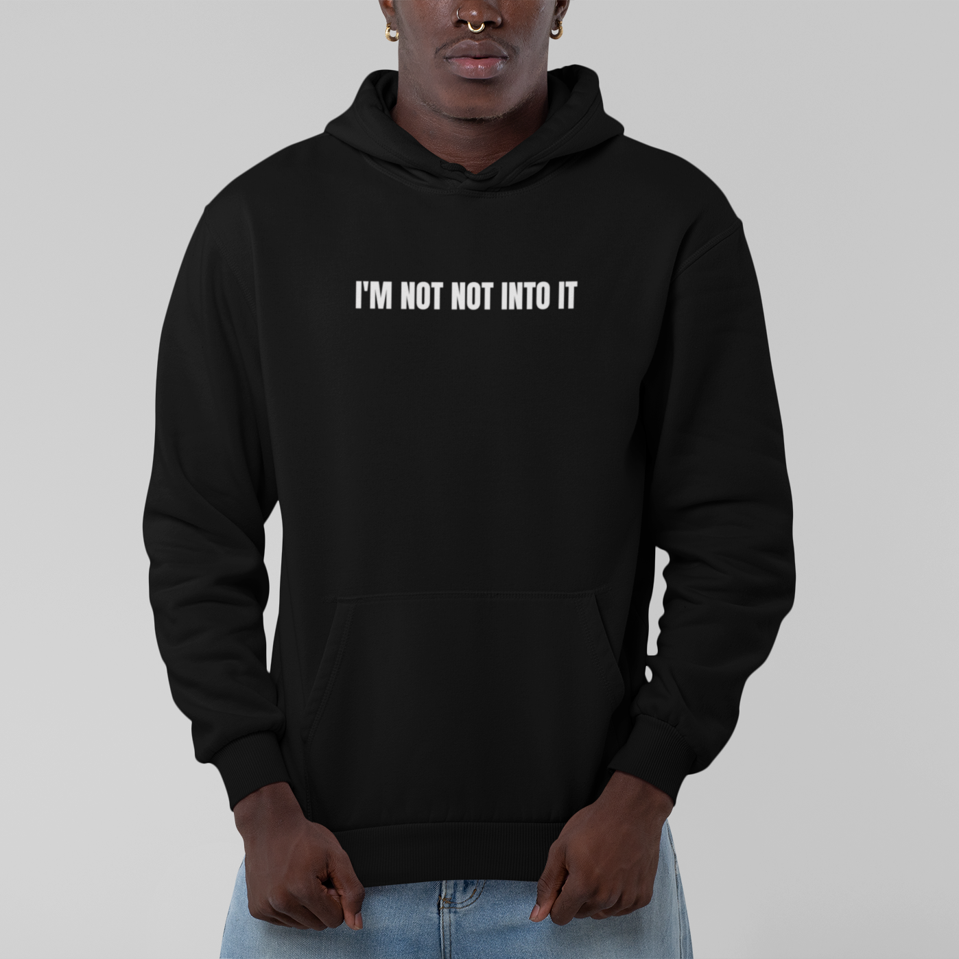 Black 'I'm Not Not Into It' black soft hoodie featuring a bold and playful text design, perfect for casual and cozy wear.
