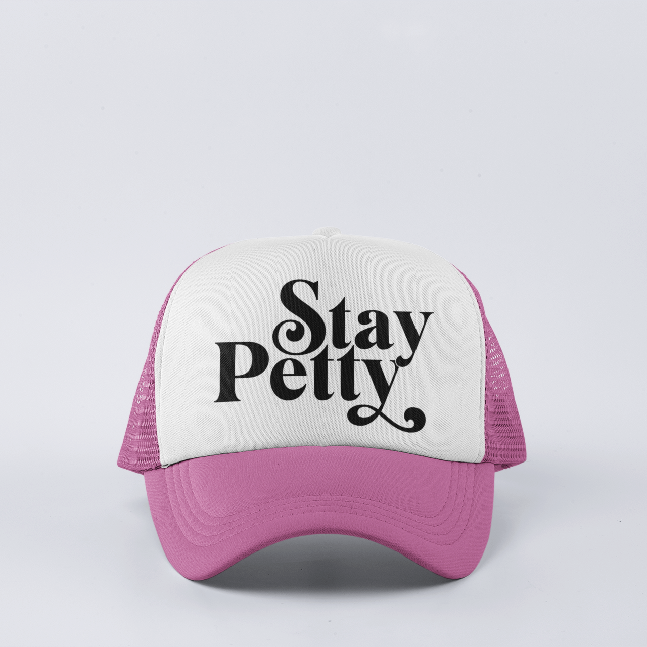 pink funny trucker hat with ‘Stay Petty’ design, featuring a snapback closure and mesh back for comfort.