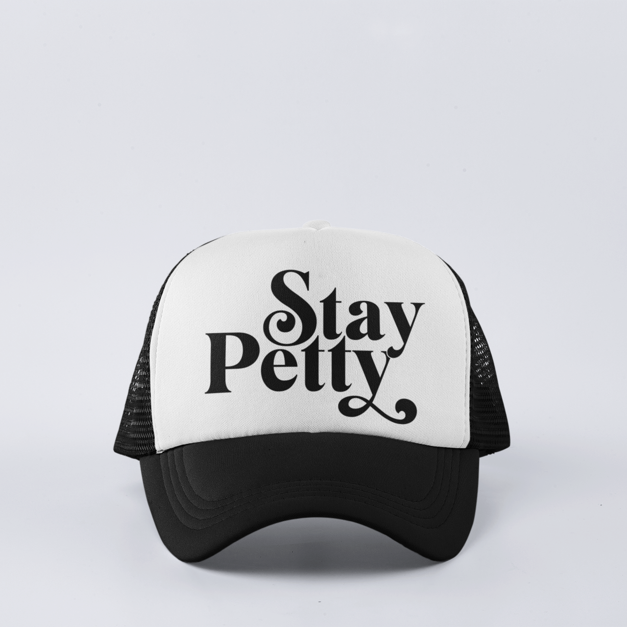 Black funny trucker hat with ‘Stay Petty’ design, featuring a snapback closure and mesh back for comfort.