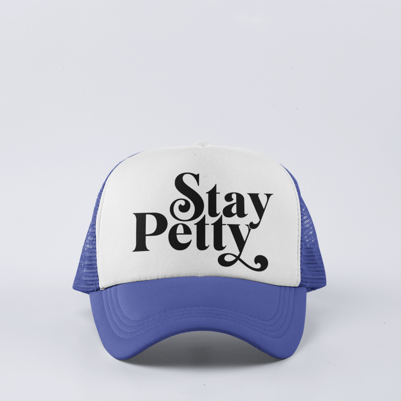 Royal funny trucker hat with ‘Stay Petty’ design, featuring a snapback closure and mesh back for comfort.