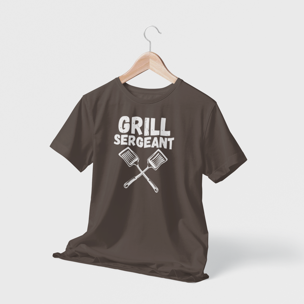 Black hanging t-shirt with “Grill Sergeant” text and crossed spatula design