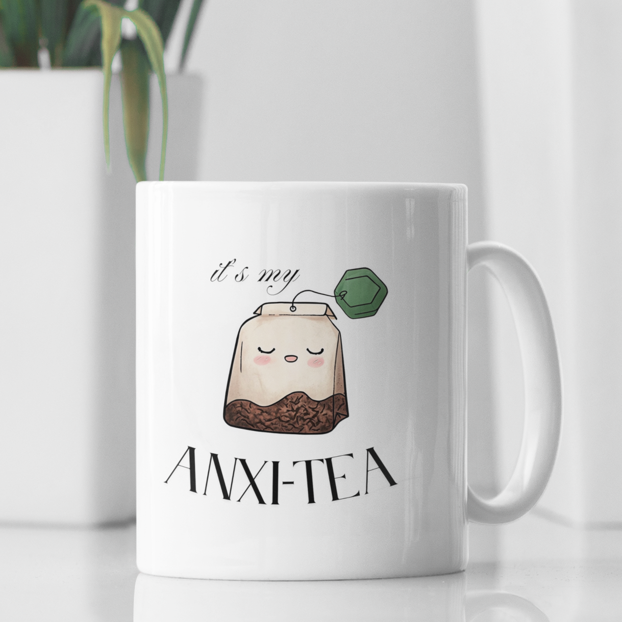 Funny 15 oz coffee mug with cartoon tea bag and “It’s My Anxie-Tea” mental health quote, white