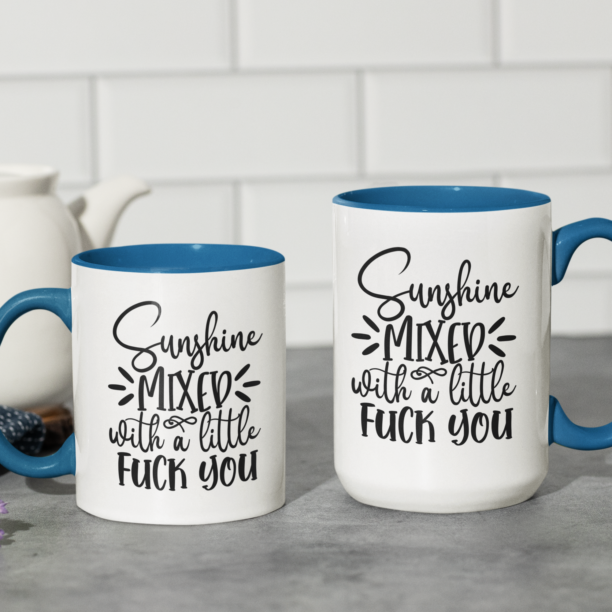 Blue 'Sunshine Mixed with a Little F*** You' ceramic coffee mug, available in 11 oz and 15 oz sizes with bold graphic and blue handle