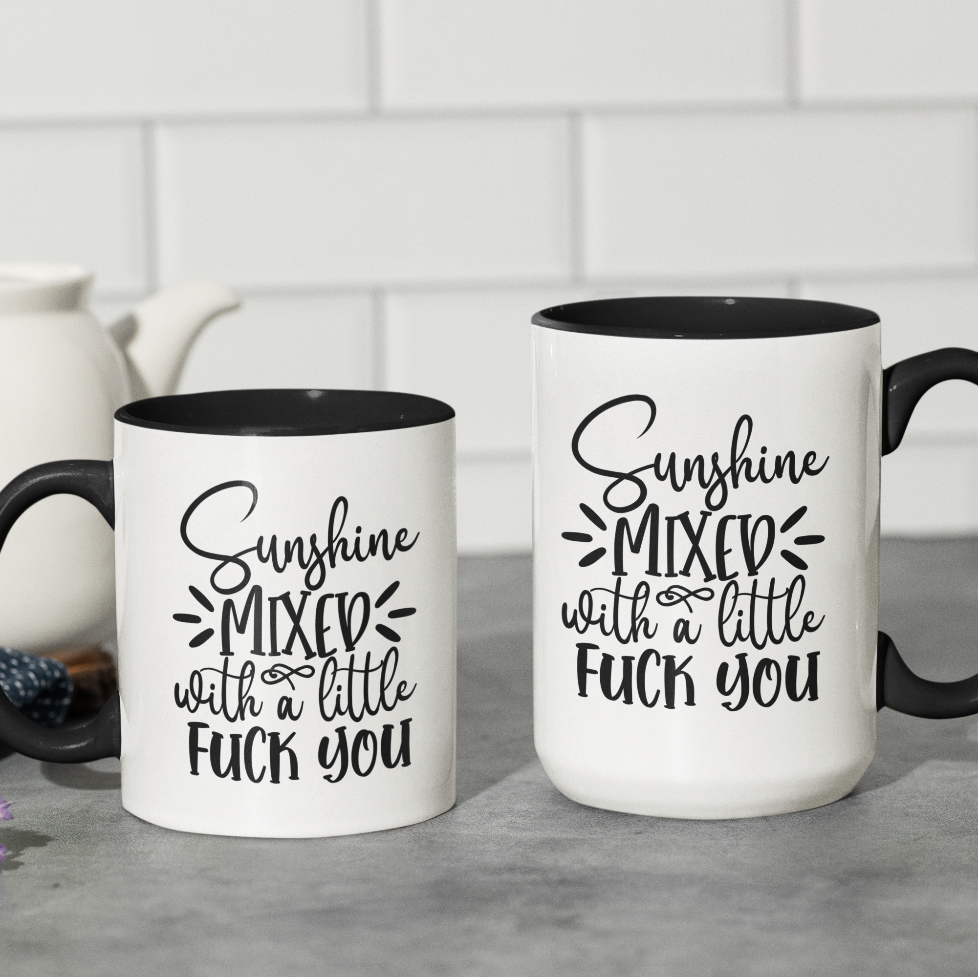 Black 'Sunshine Mixed with a Little F*** You' ceramic coffee mug, available in 11 oz and 15 oz sizes with bold graphic and blue handle