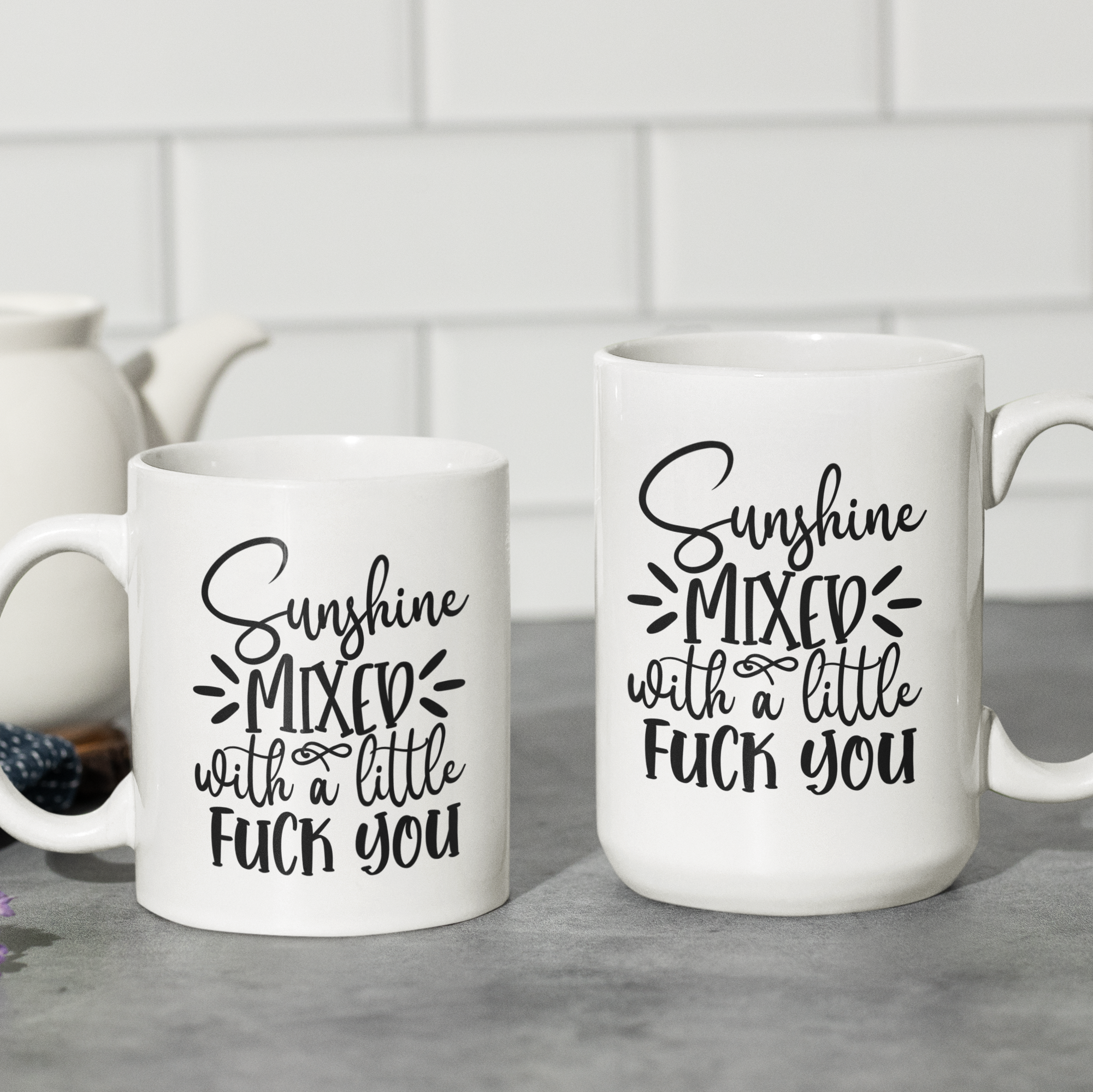 white 'Sunshine Mixed with a Little F*** You' ceramic coffee mug, available in 11 oz and 15 oz sizes with bold graphic and blue handle