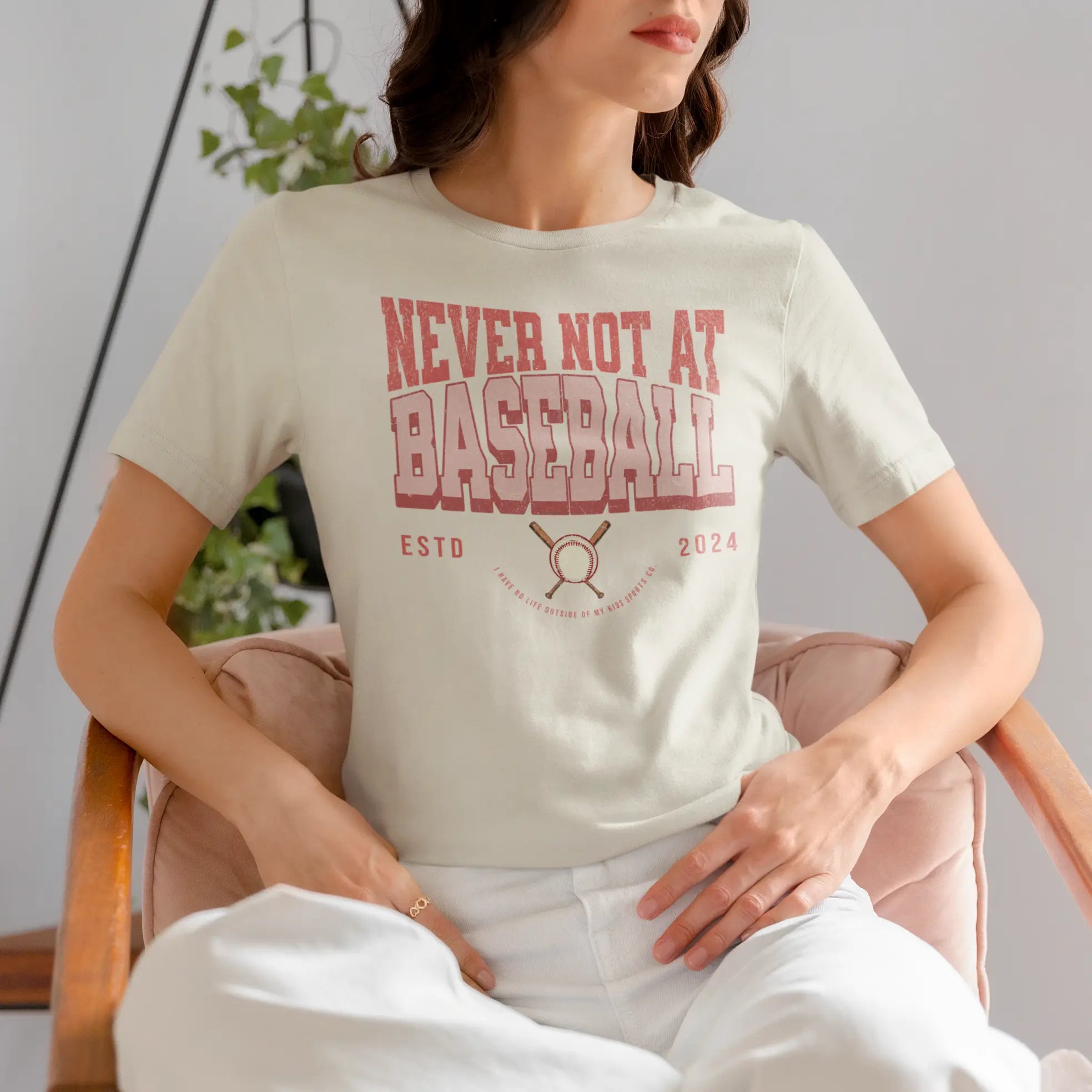 Woman wearing “Never Not At Baseball” t-shirt, funny baseball parent shirt for tournaments and practice days