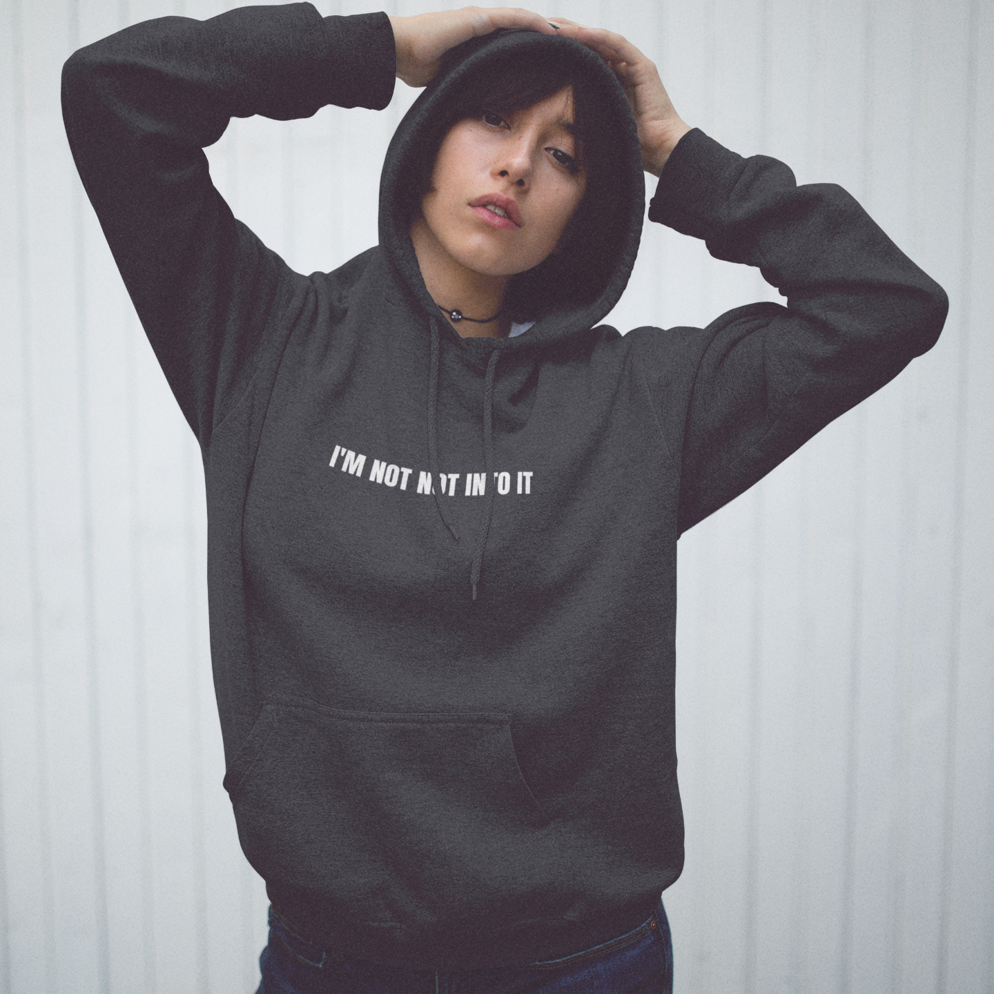 Dark Gray 'I'm Not Not Into It' black soft hoodie featuring a bold and playful text design, perfect for casual and cozy wear.