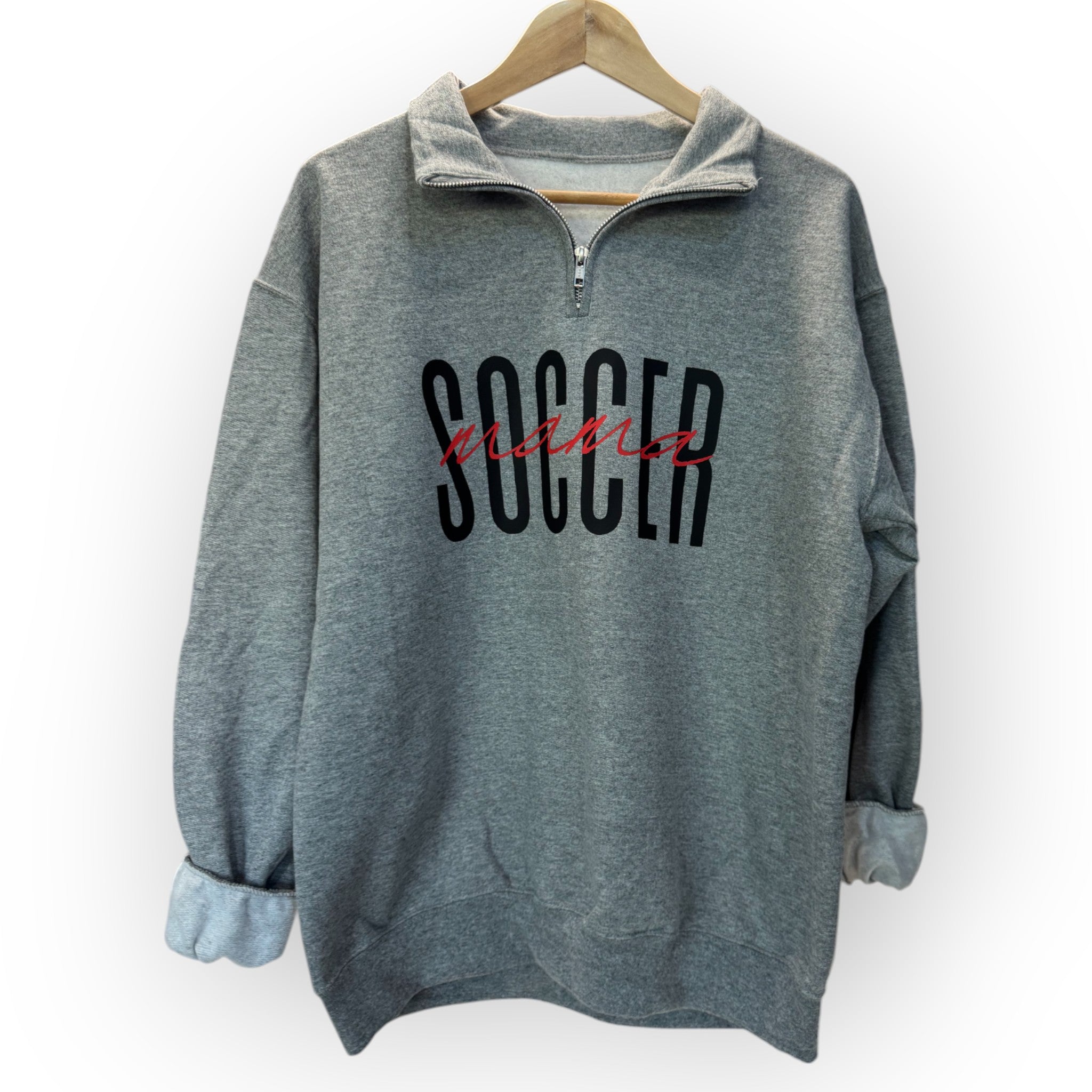 hanging dark gray Customizable 'Sports Mama' 1/4 zip pullover for soccer moms and sports fans, featuring a soft fabric and stylish design, perfect for game days.